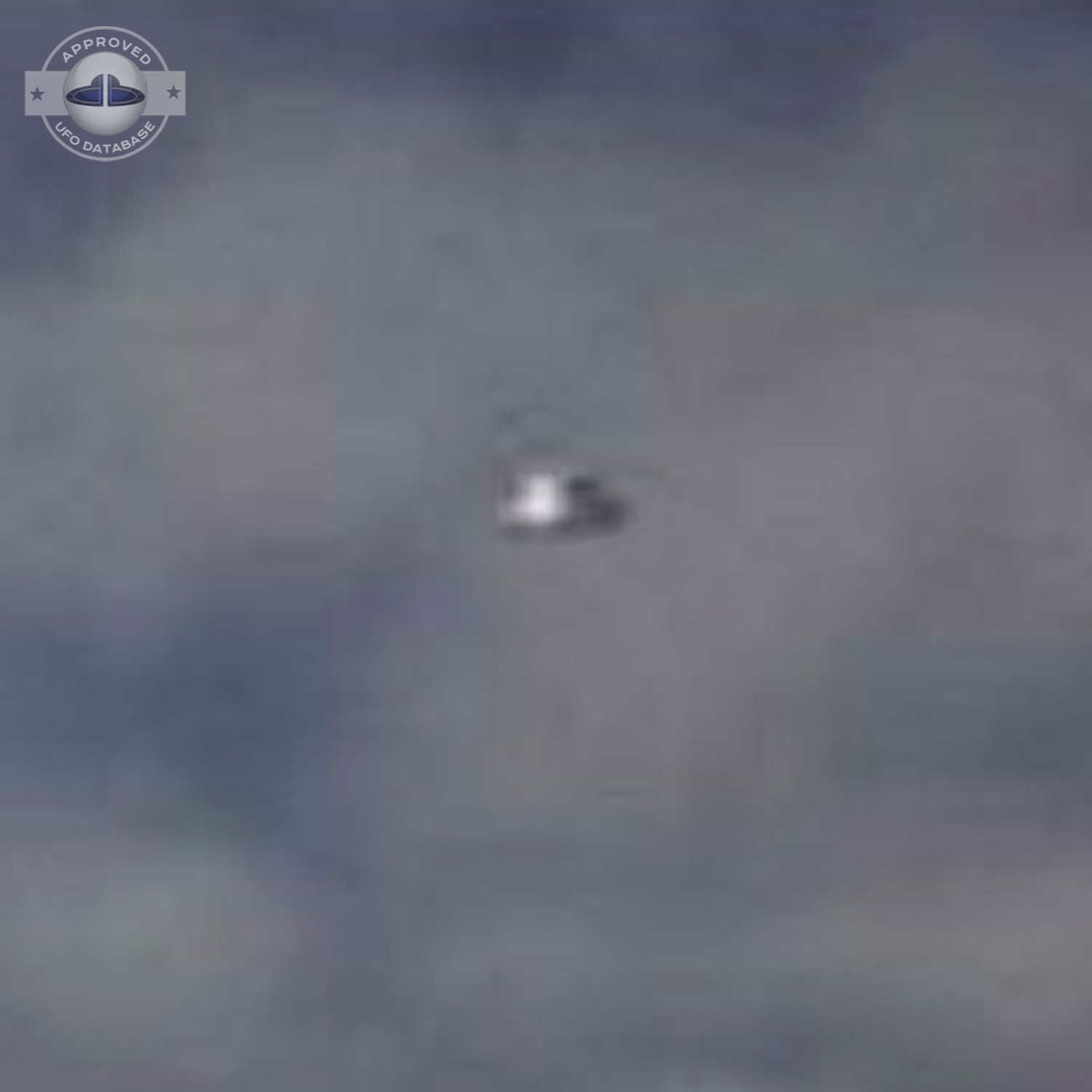 UFO over the country in Scotland during the day in a blue sky UFO Picture #15-3