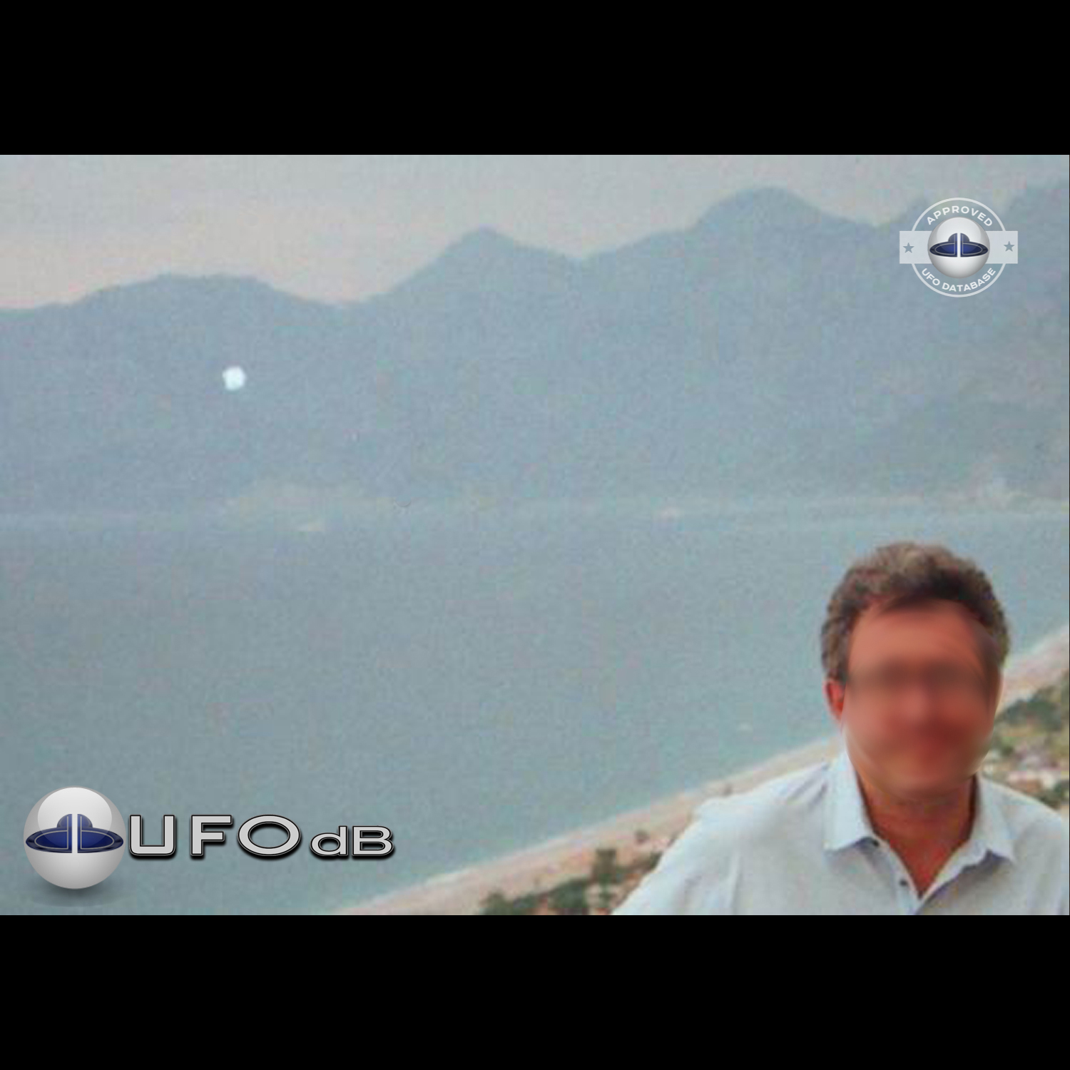 UFO passing over unknown body of water somewhere in Turkey | May 2003 UFO Picture #173-1