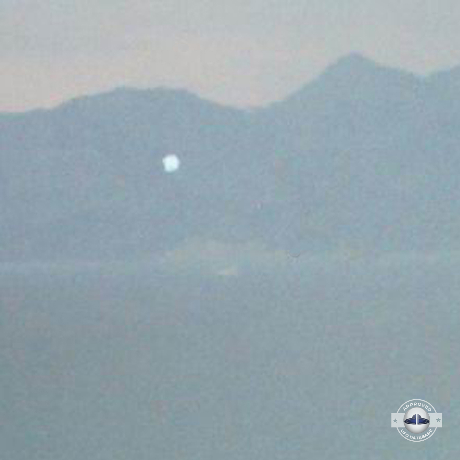 UFO passing over unknown body of water somewhere in Turkey | May 2003 UFO Picture #173-3