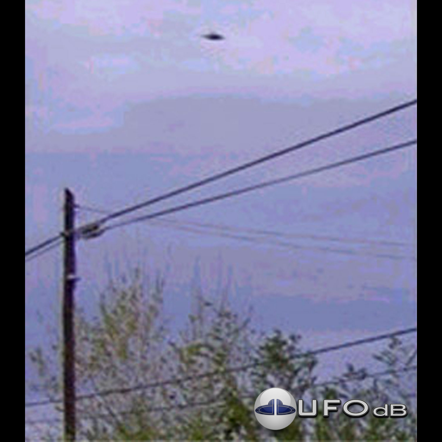 UFO over electric line in grey sky - UFO picture taken in Valcheta UFO Picture #20-1