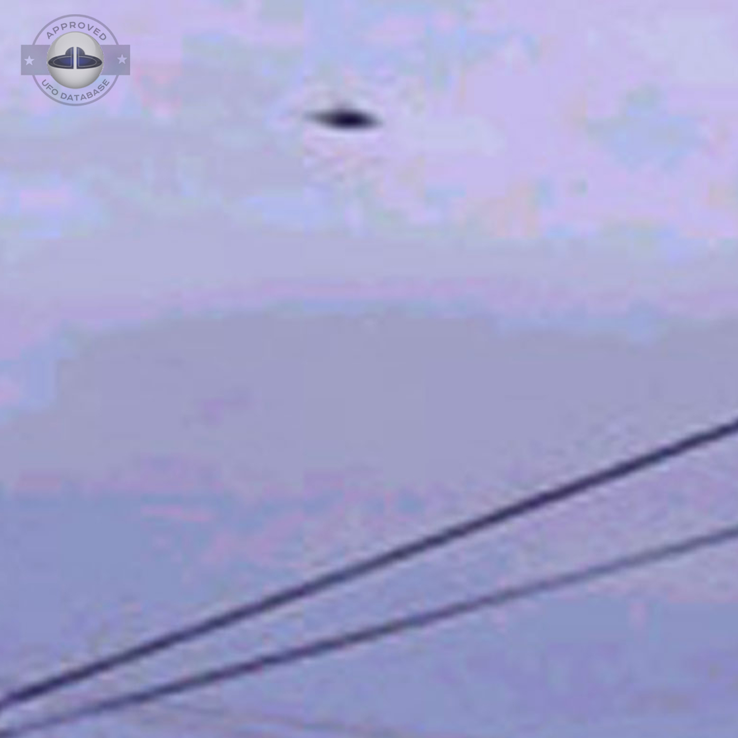 UFO over electric line in grey sky - UFO picture taken in Valcheta UFO Picture #20-2