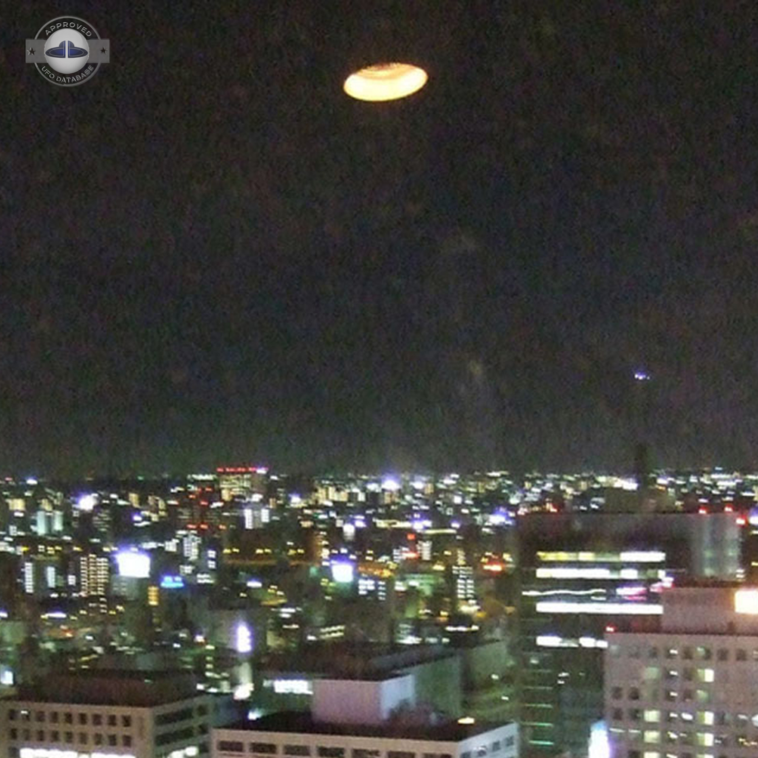 Light Orange glowing UFO saucer over Nagoya, Chubu | Japan 2007 UFO Picture #201-3