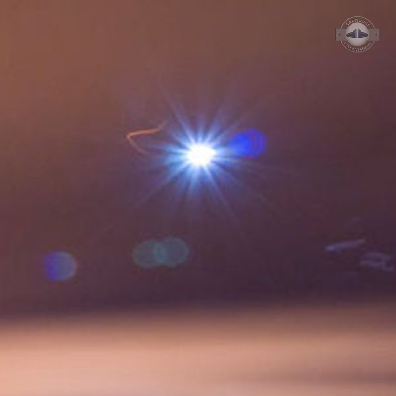 Bright glowing UFO caught on picture during long exposure | England UFO Picture #218-4