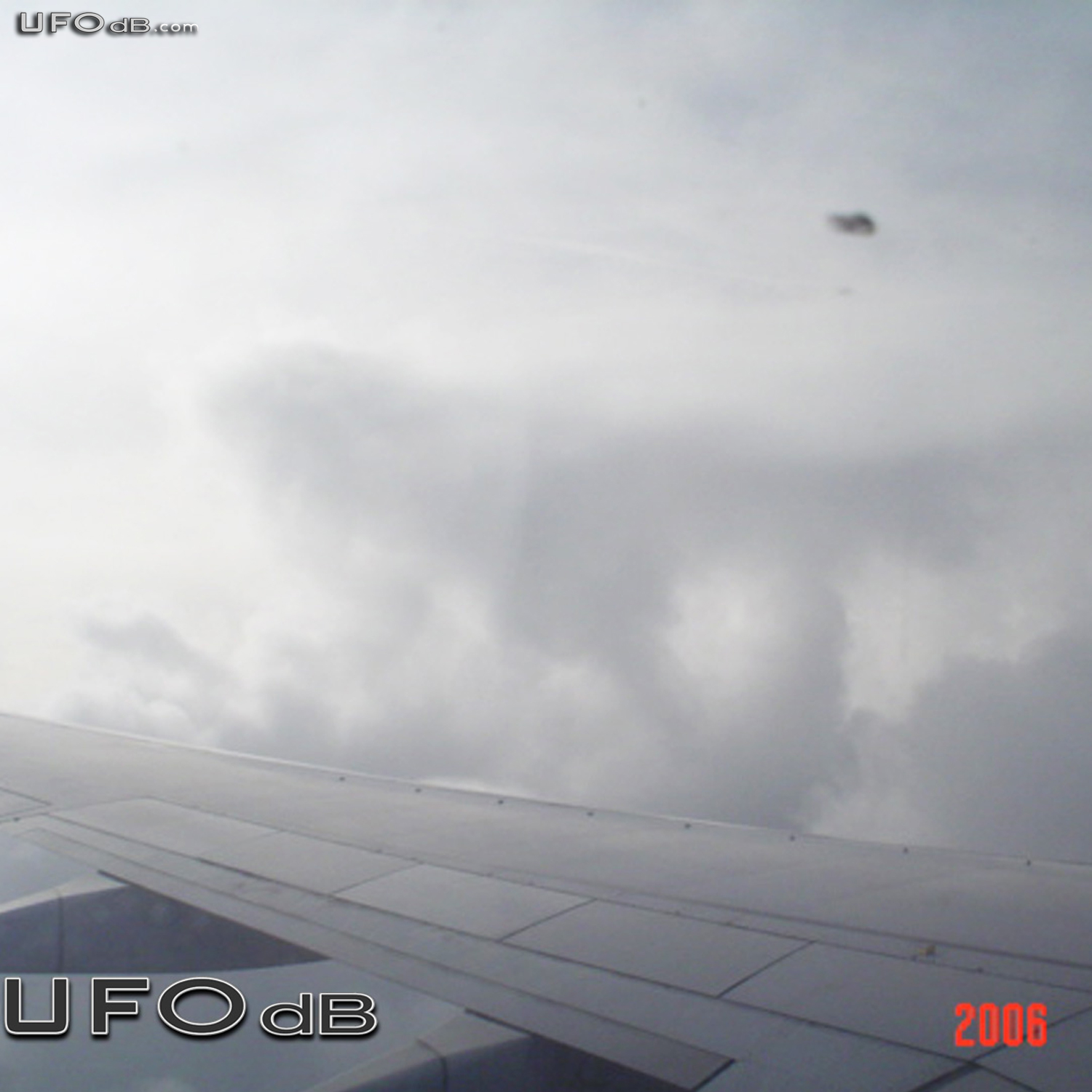 KLM Airplane passenger see UFO near wing | Amsterdam, Netherlands 2006 UFO Picture #255-2