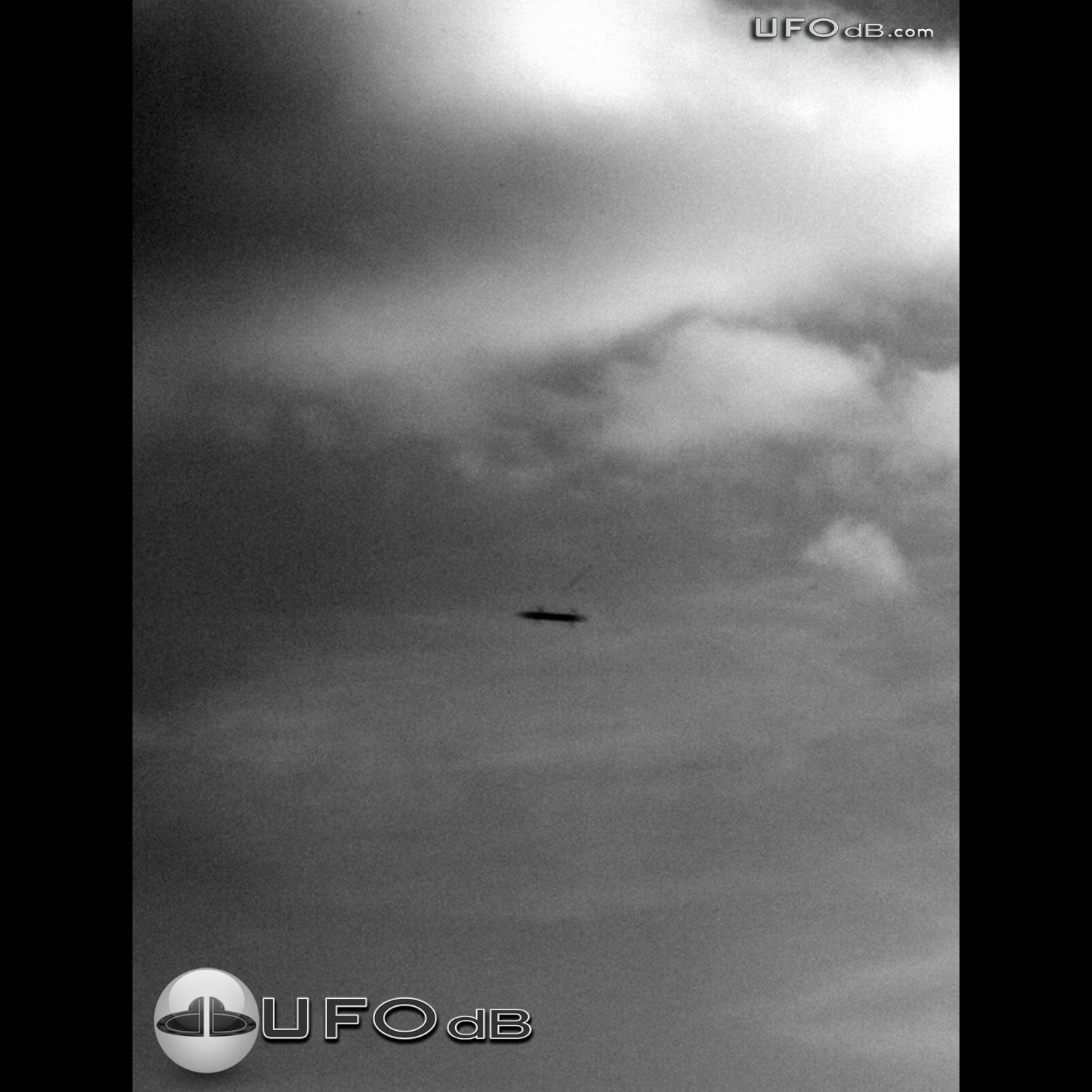 Dark Winged Saucer UFO over the town of Havant, England | April 7 2011 UFO Picture #263-1