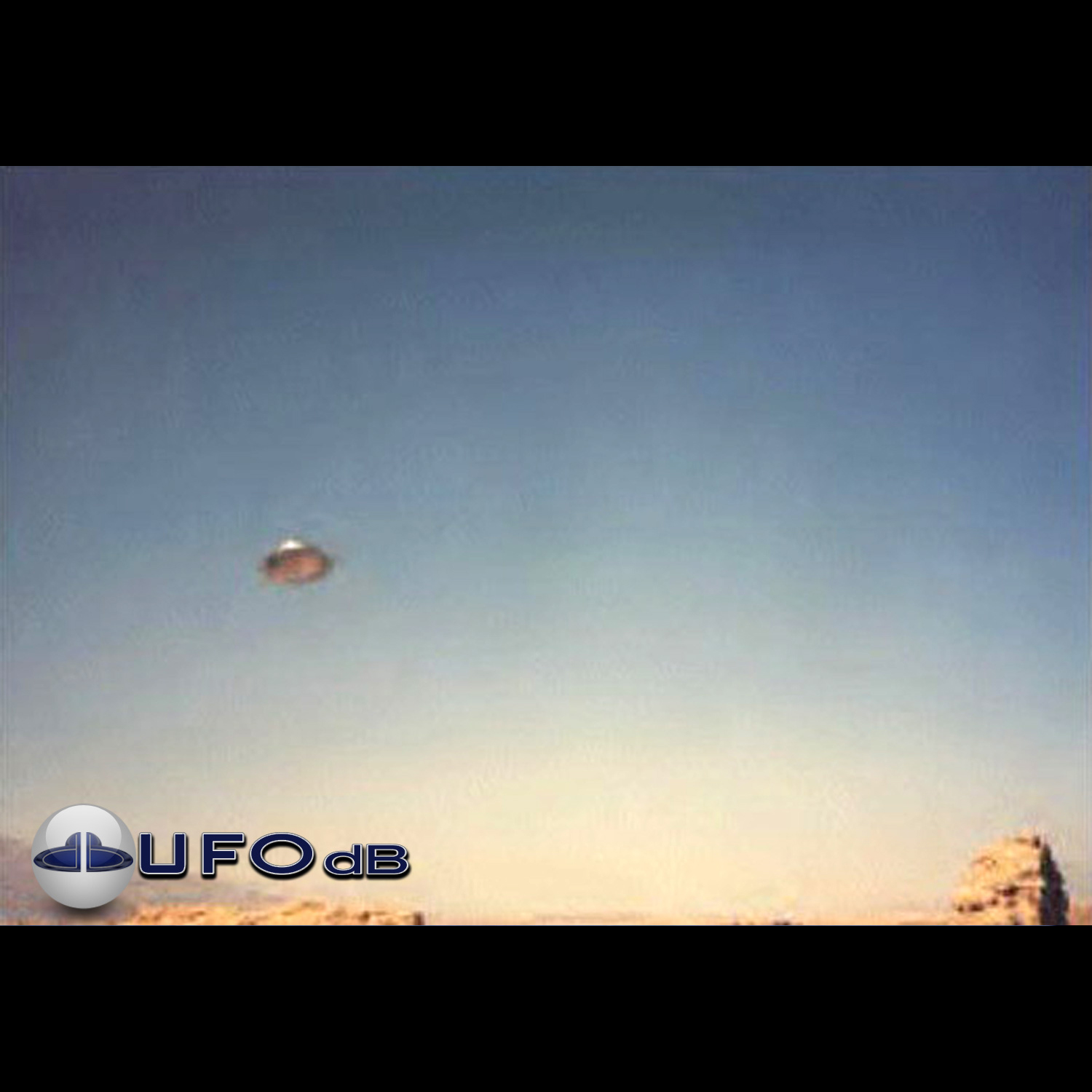 UFO Picture caught in bright day light over desertic mountains UFO Picture #30-1