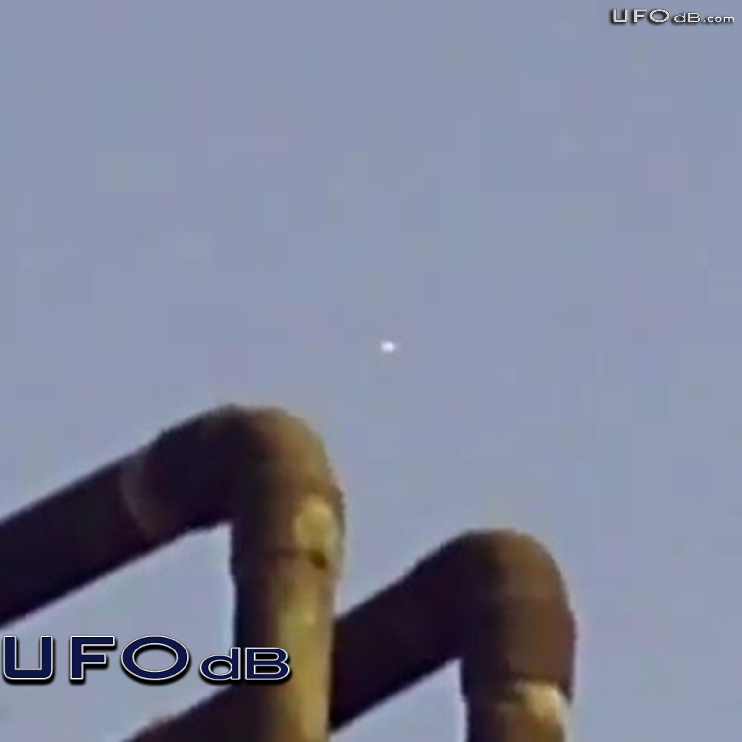 White craft UFO passing in the clouds of Mexico City | May 13 2011 UFO Picture #305-2