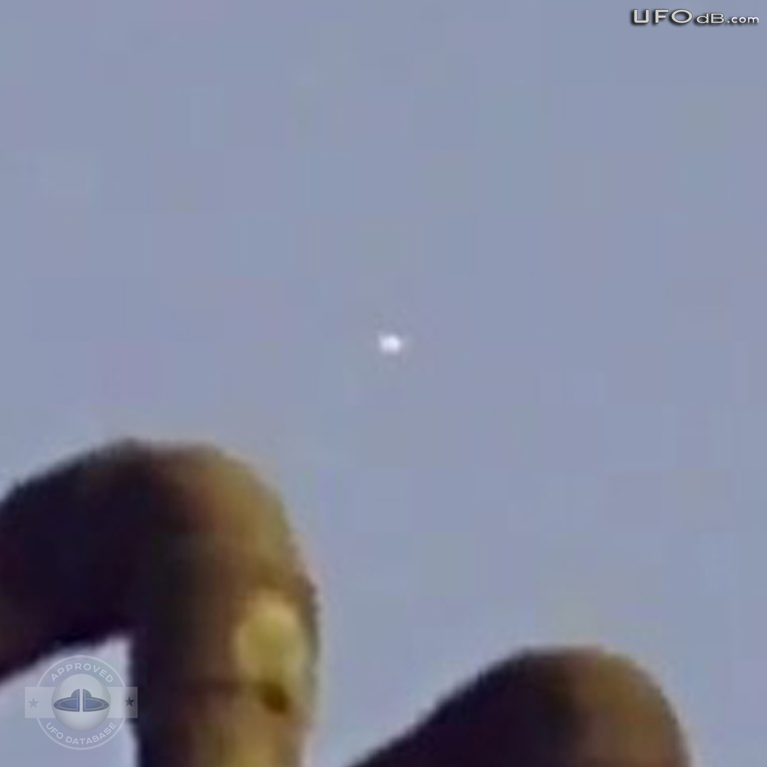 White craft UFO passing in the clouds of Mexico City | May 13 2011 UFO Picture #305-3