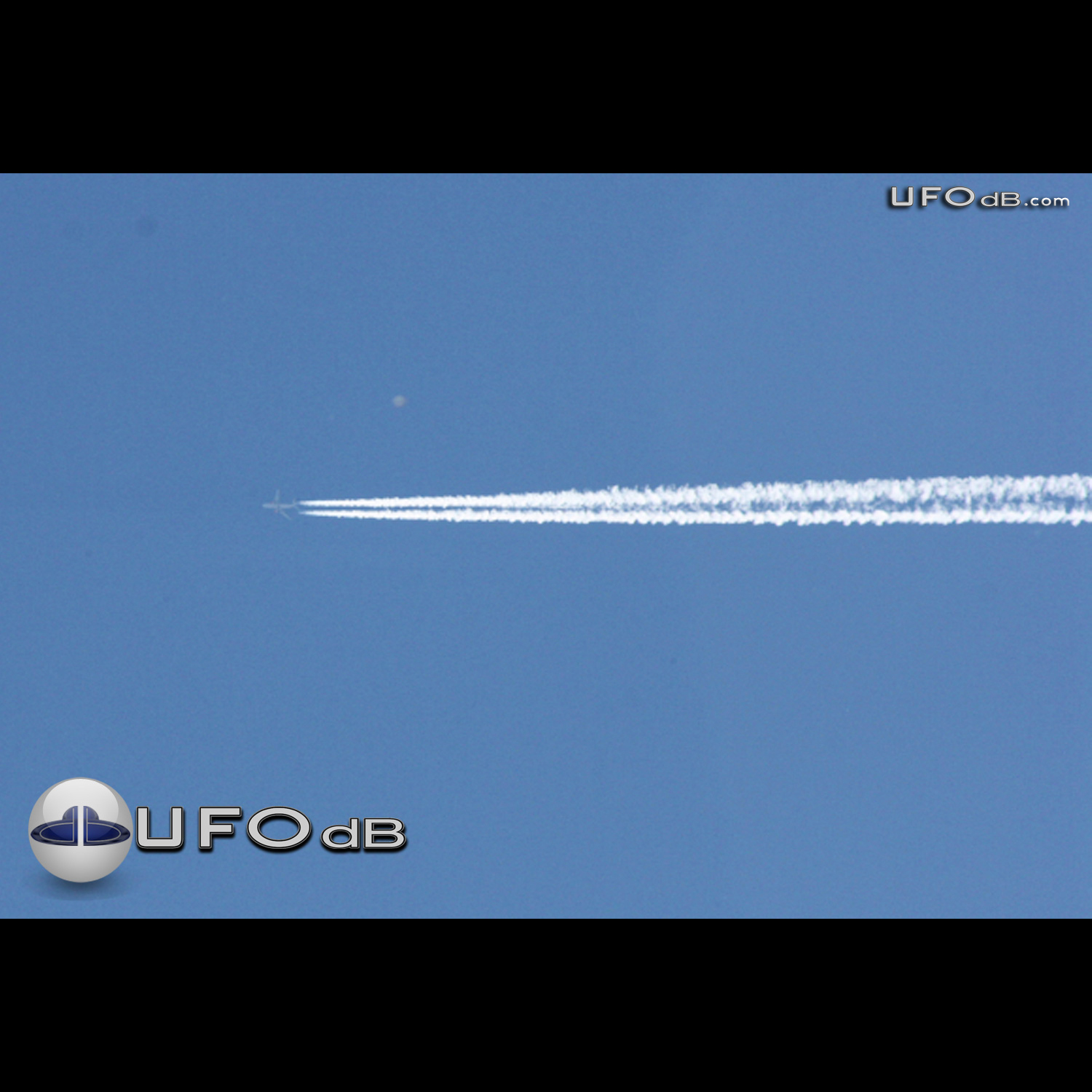 High Altitude UFO near airplane caught on picture Norwich UK May 2011 UFO Picture #309-1