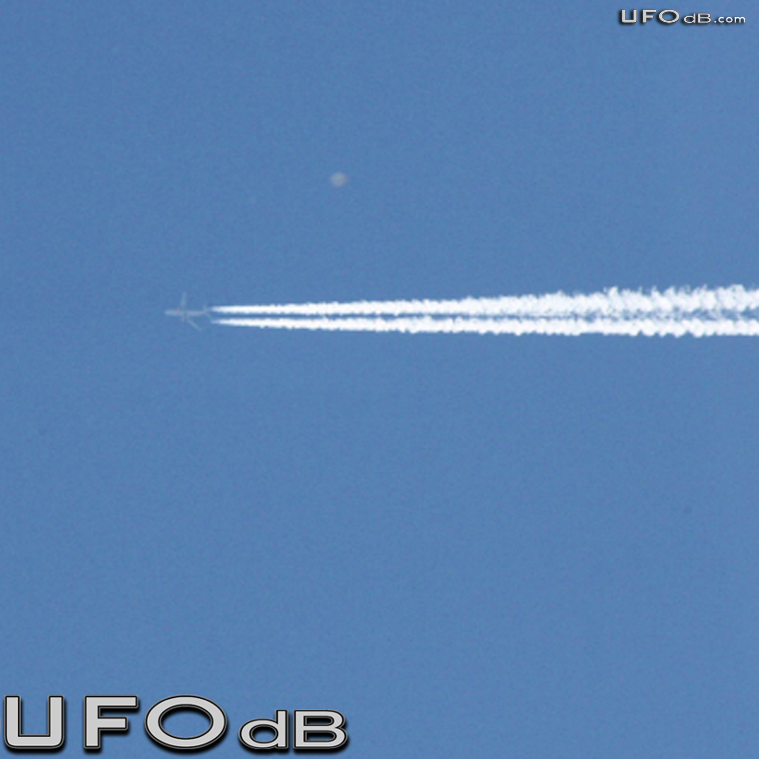 High Altitude UFO near airplane caught on picture Norwich UK May 2011 UFO Picture #309-2