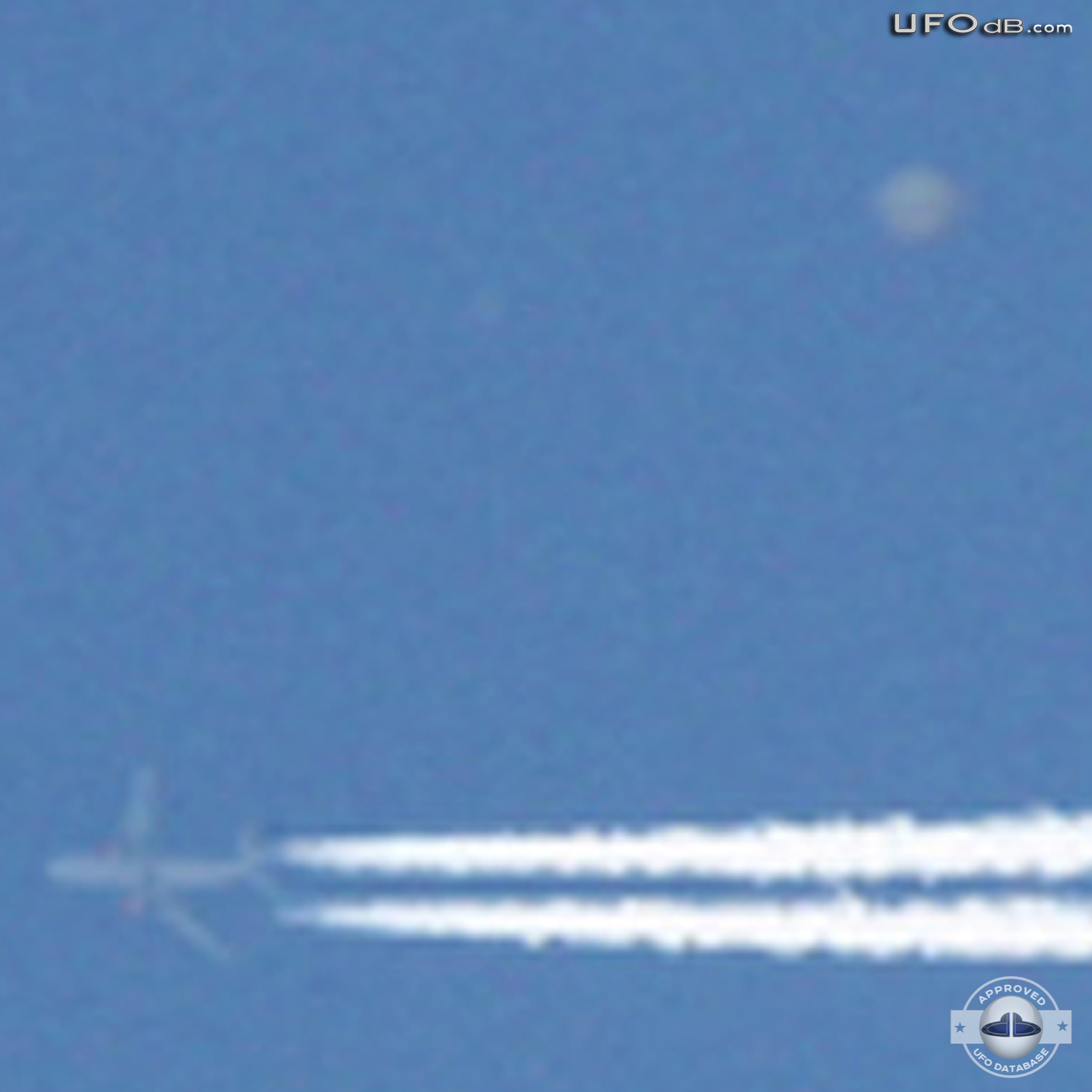 High Altitude UFO near airplane caught on picture Norwich UK May 2011 UFO Picture #309-4