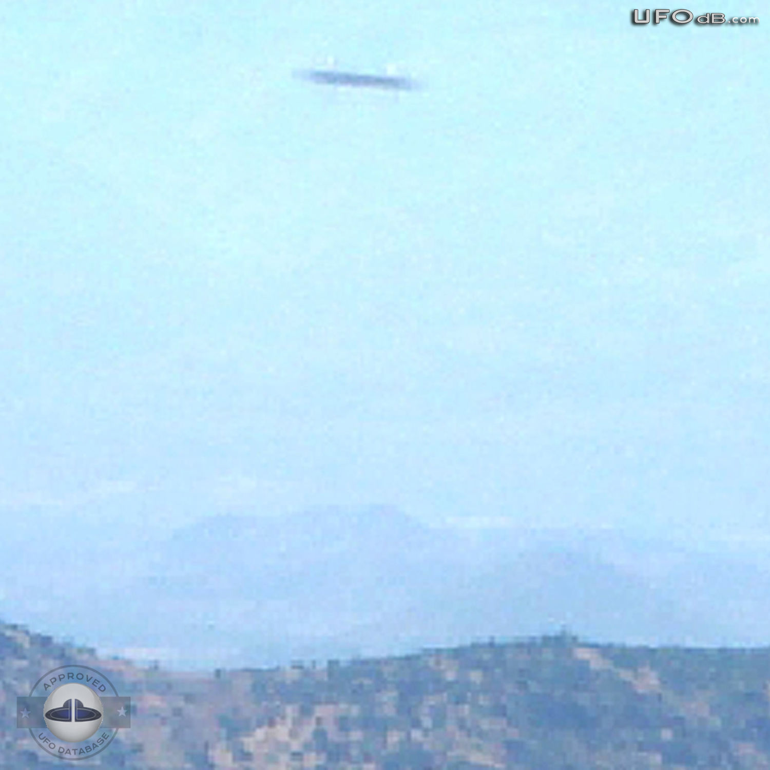 Colombia Saucer flying over the hills caught on picture | March 3 2003 UFO Picture #322-2