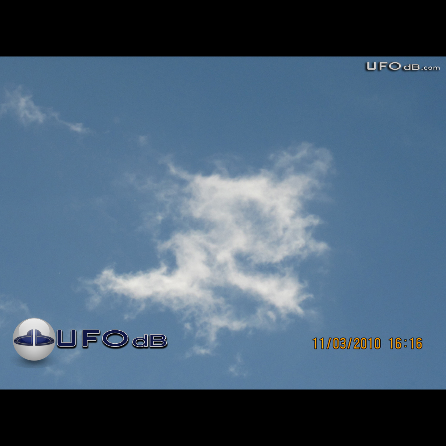 White disc UFOs hides behind clouds Davao Philippines November 3 2010 UFO Picture #340-1