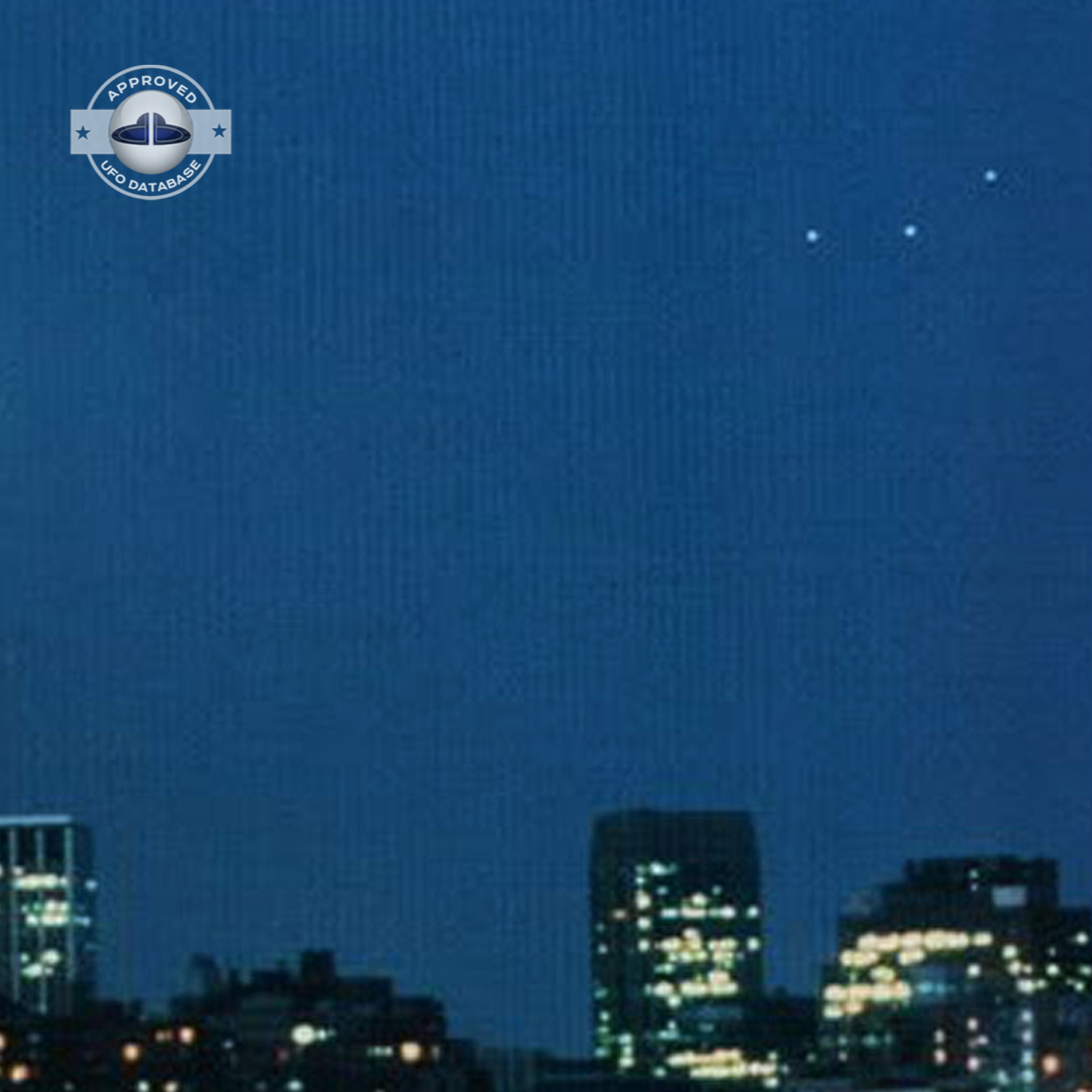 UFO picture showing 3 bright white UFO over Empire State Building UFO Picture #35-3