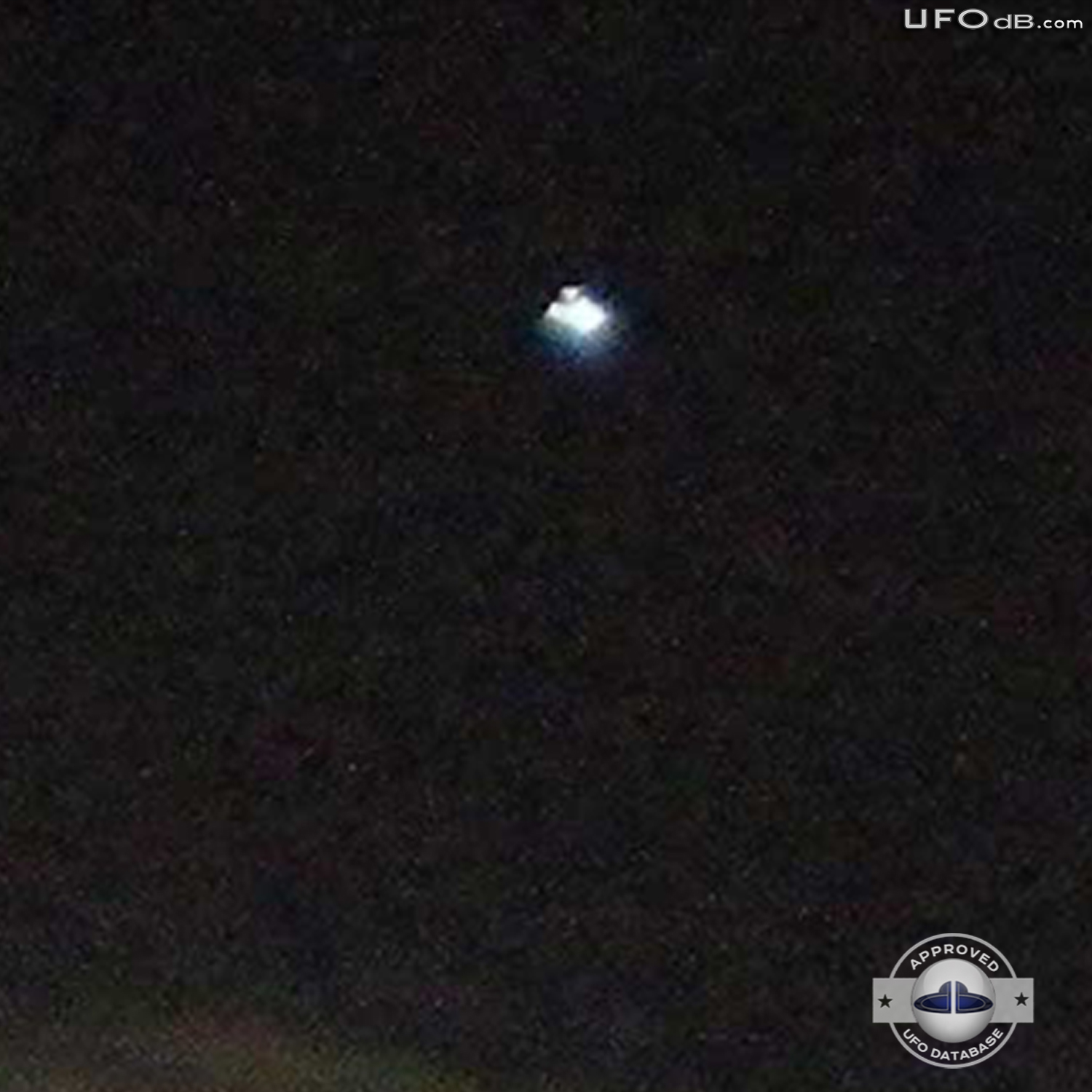 Moon picture captures bright white glowing UFO over a city in Ecuador UFO Picture #352-3