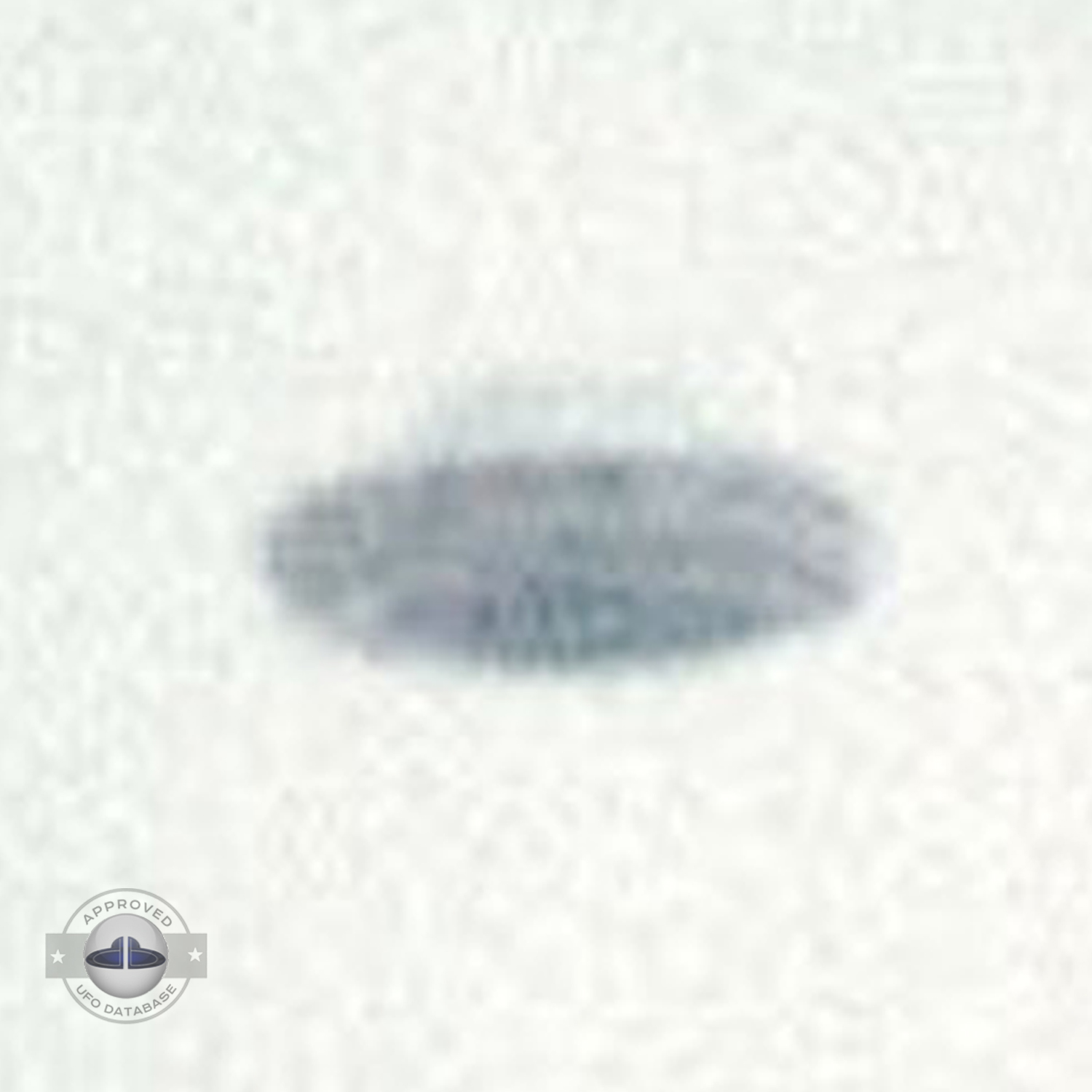 UFO picture showing UFO over snowy mountains during the day UFO Picture #36-4