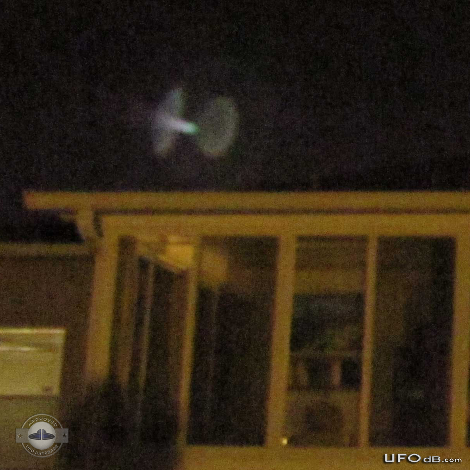 Mysterious picture of UFO appearing over a house in Orlando, Florida UFO Picture #381-2