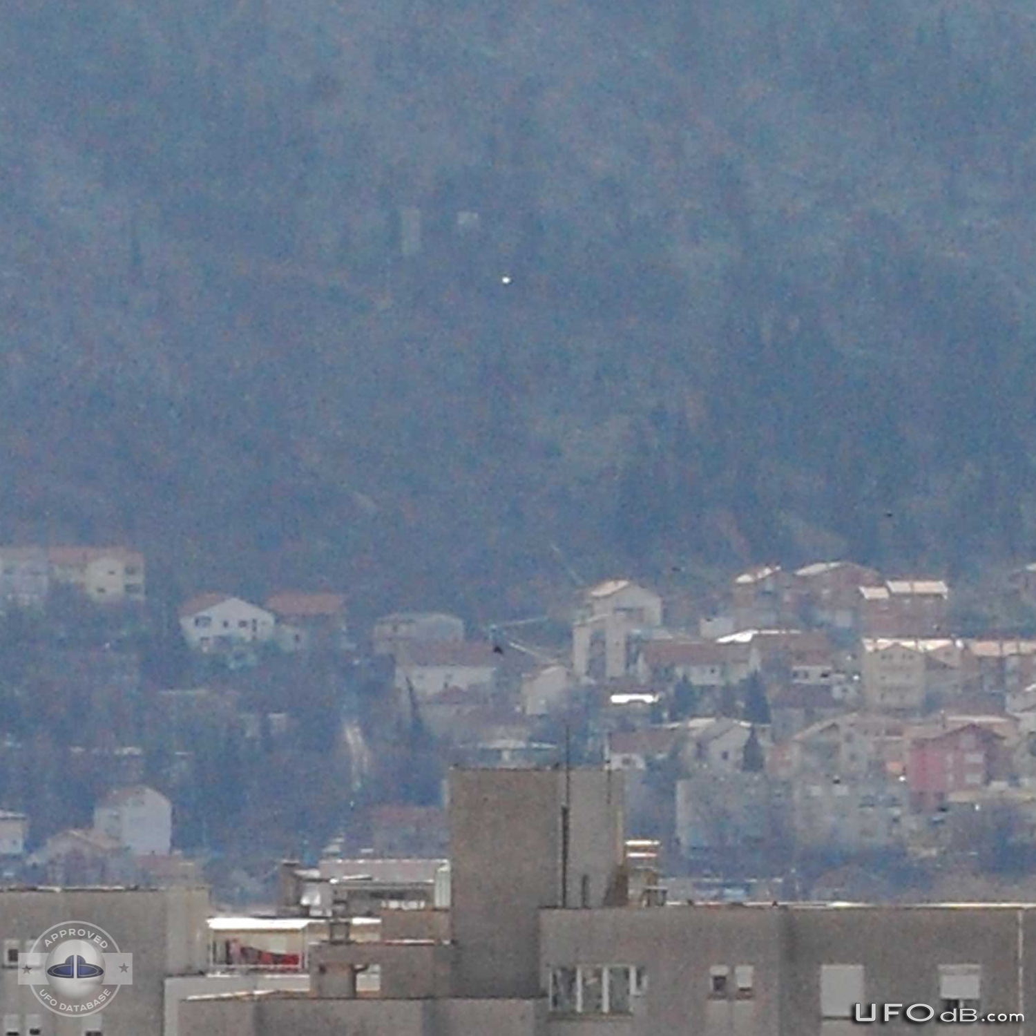 White saucer ufo over the city of Mostar in Bosnia caught on picture UFO Picture #396-1