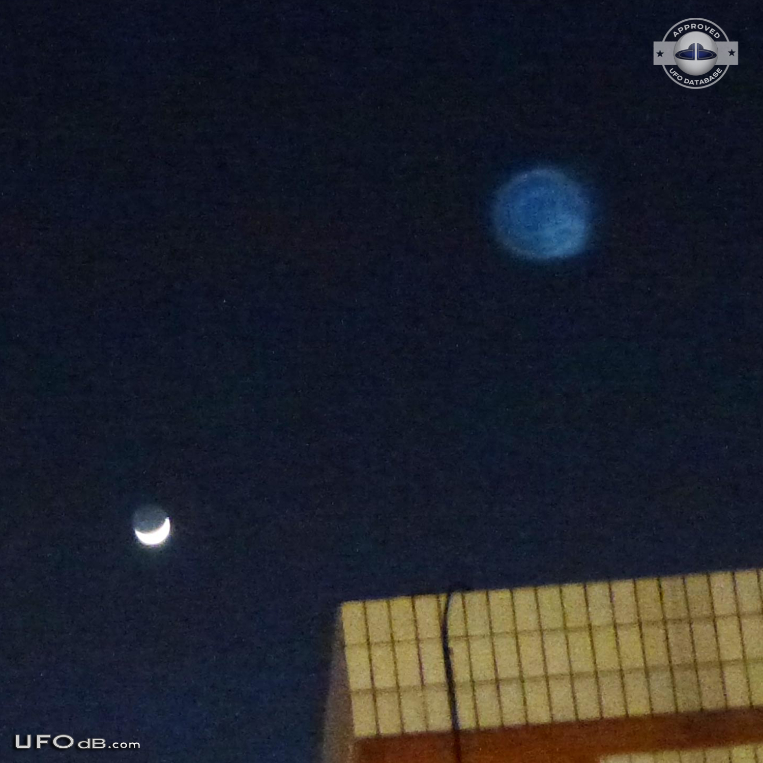 Blue round UFO appears on photo over buildings - Catalonia, Spain 2012 UFO Picture #407-2