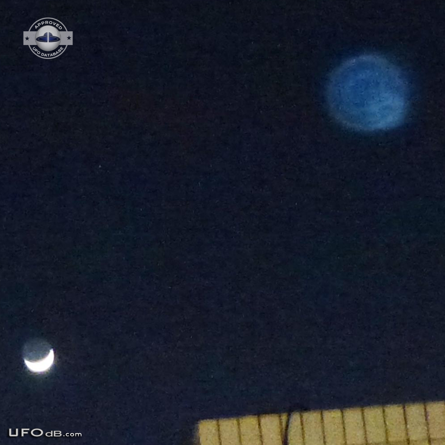 Blue round UFO appears on photo over buildings - Catalonia, Spain 2012 UFO Picture #407-3