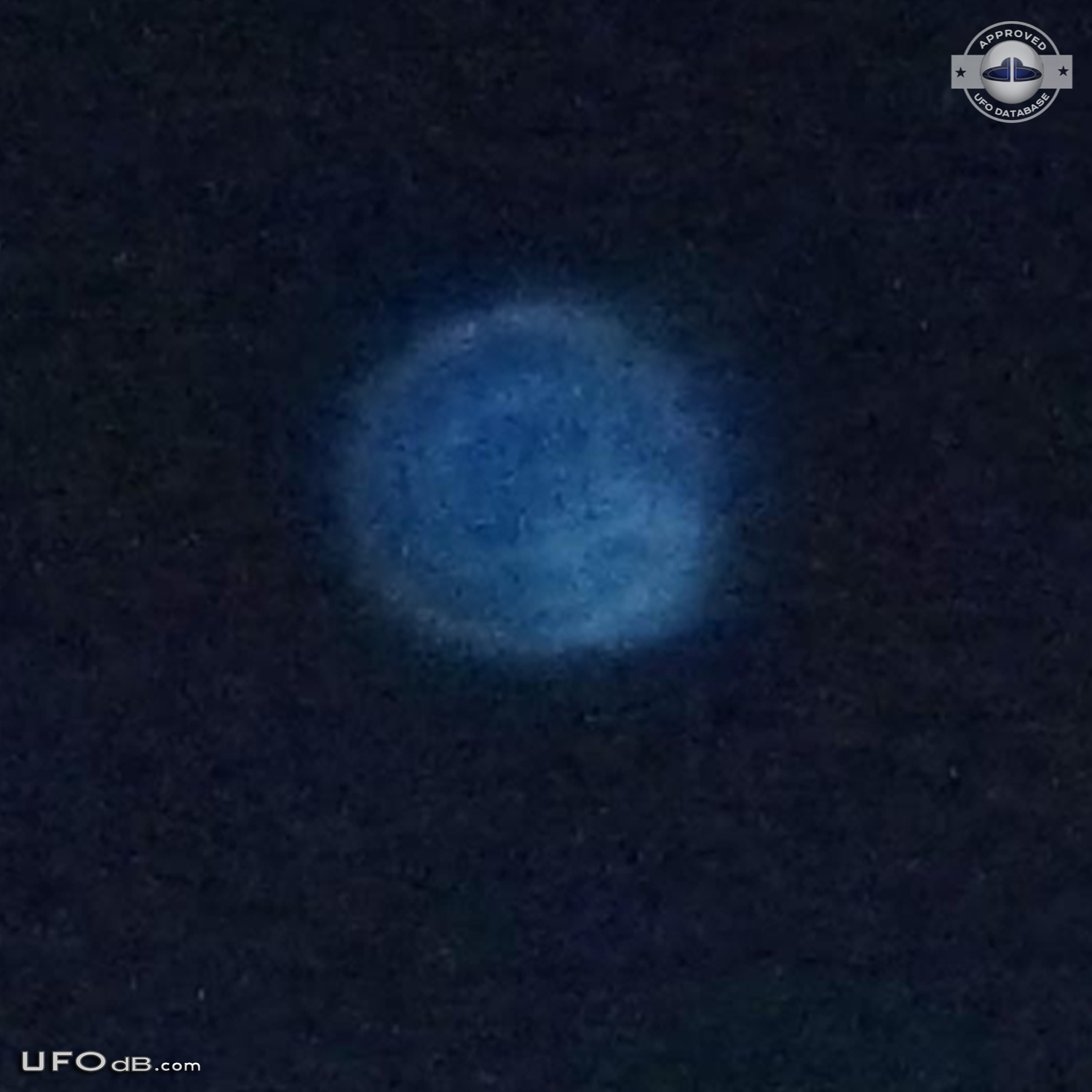 Blue round UFO appears on photo over buildings - Catalonia, Spain 2012 UFO Picture #407-4