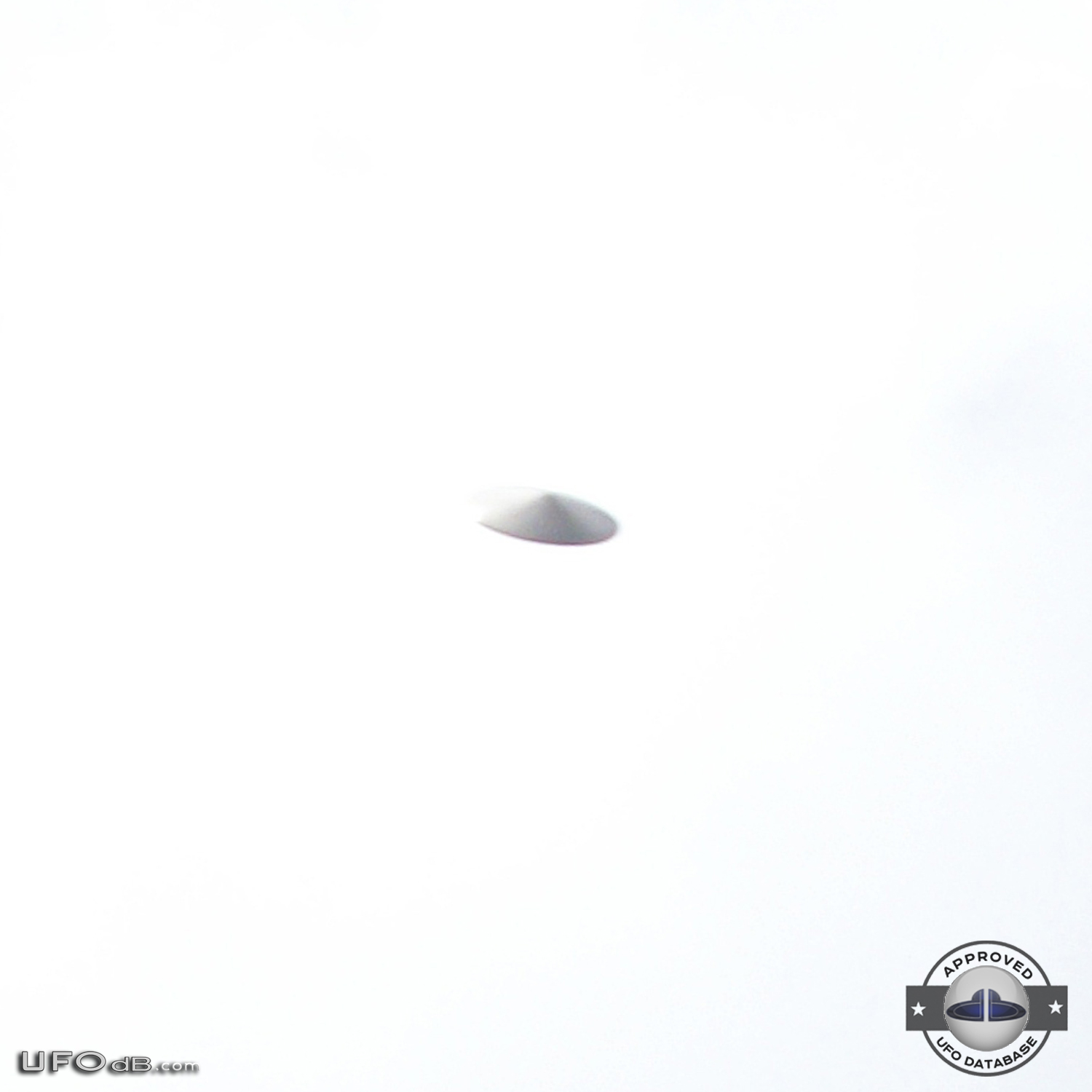 Silver saucer UFO caught on picture in Bristol, England UK - 2010 UFO Picture #412-1
