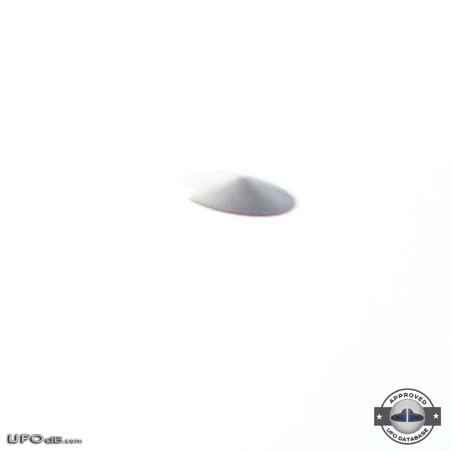 Silver saucer UFO caught on picture in Bristol, England UK - 2010 UFO Picture #412-2