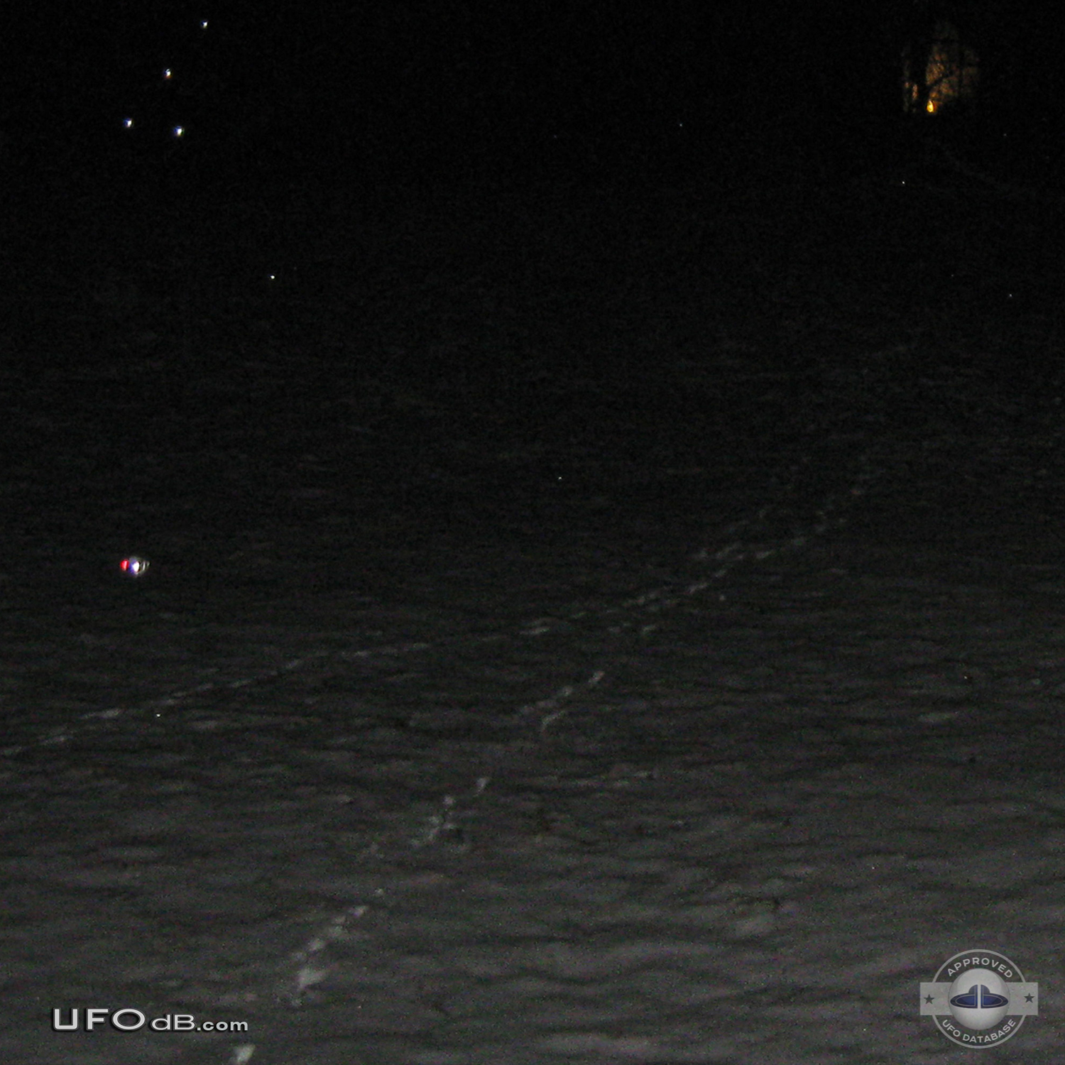 Probe UFO near the snow touching it - Kansas City, Missouri - 2012 UFO Picture #415-1