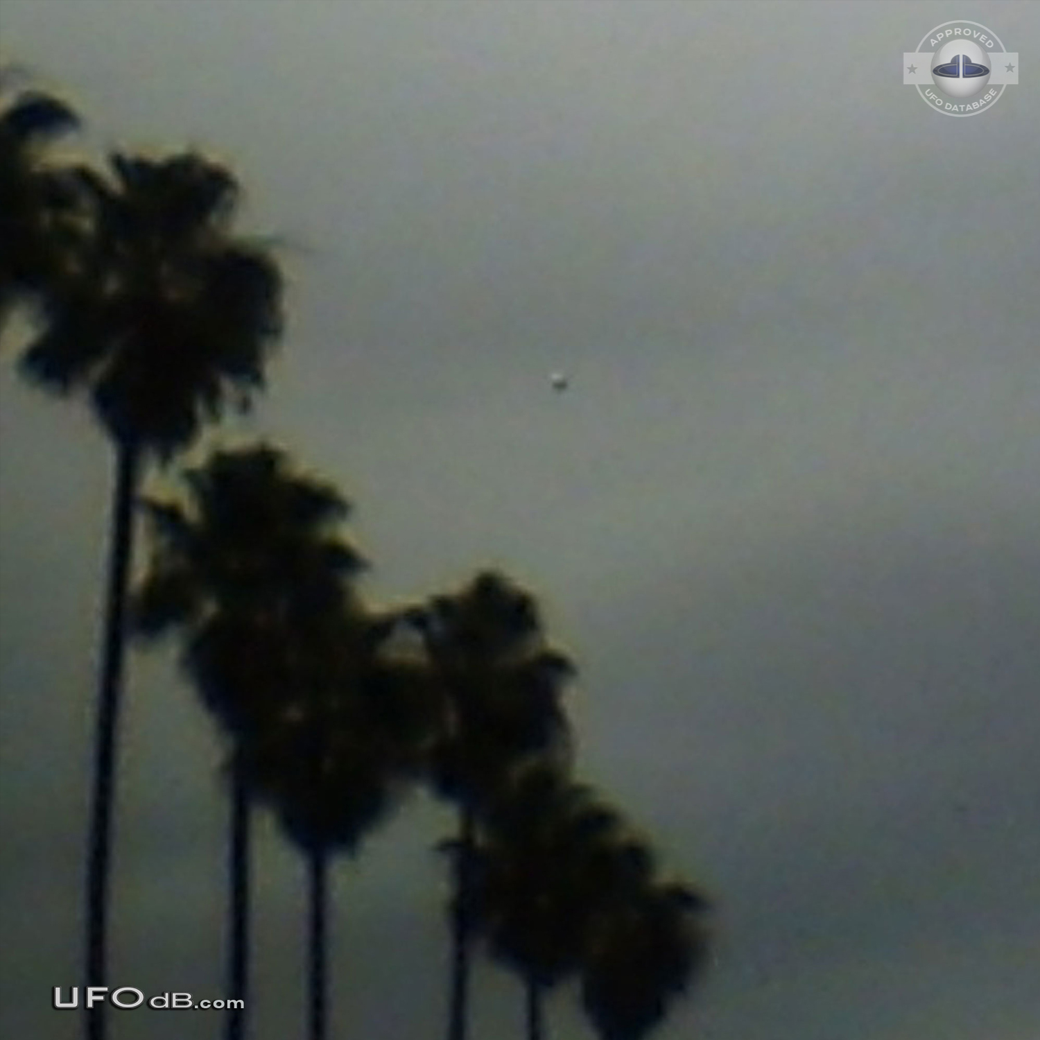 Dark UFO sphere caught on picture during storm in Los Angeles in 2009 UFO Picture #420-1