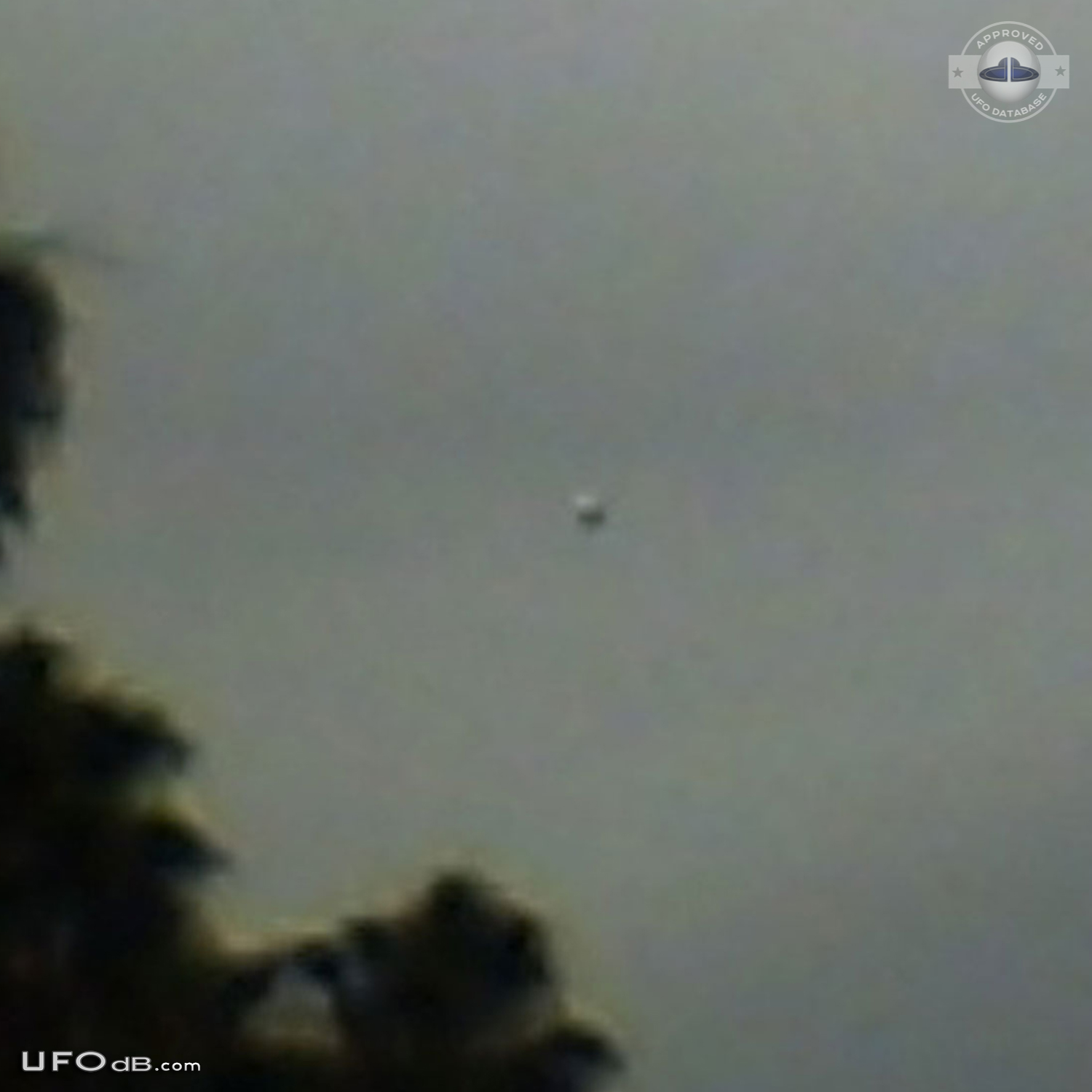 Dark UFO sphere caught on picture during storm in Los Angeles in 2009 UFO Picture #420-2
