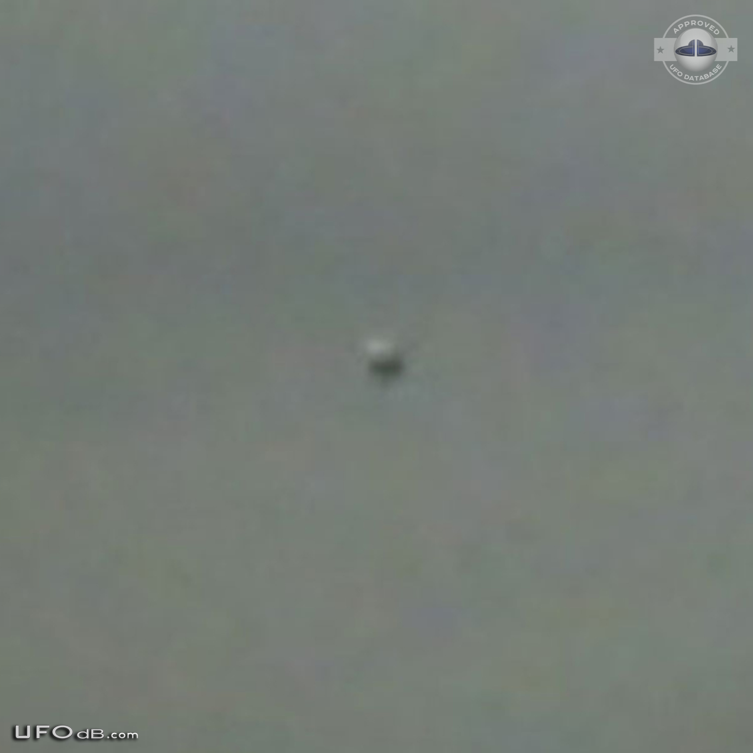 Dark UFO sphere caught on picture during storm in Los Angeles in 2009 UFO Picture #420-3