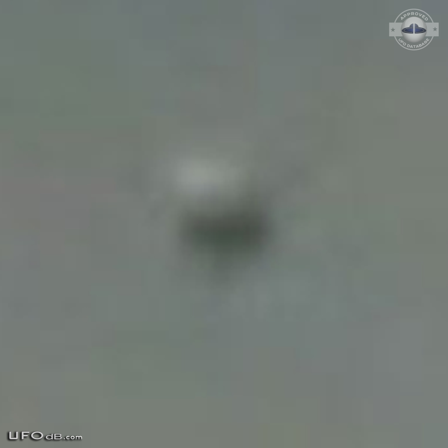 Dark UFO sphere caught on picture during storm in Los Angeles in 2009 UFO Picture #420-4