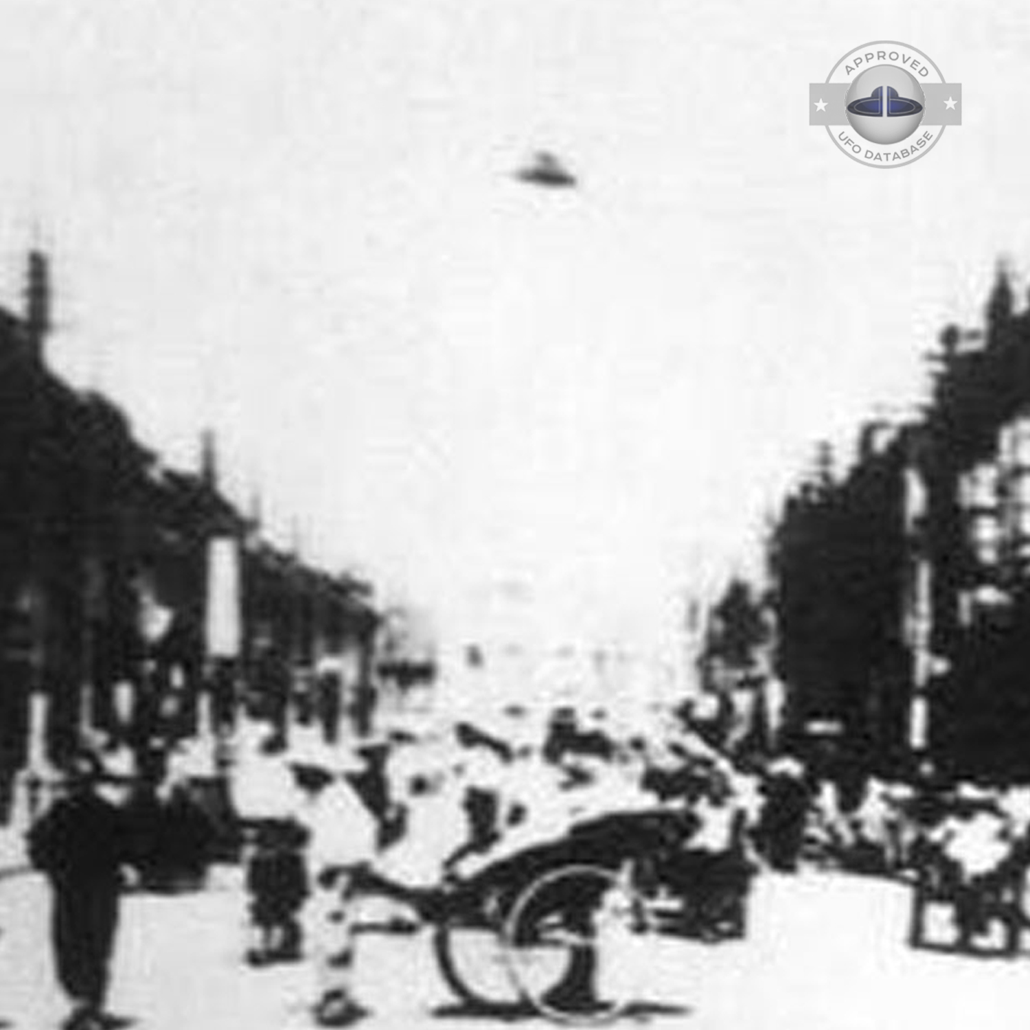 Black and white UFO picture showing UFO flying over busy street UFO Picture #43-3