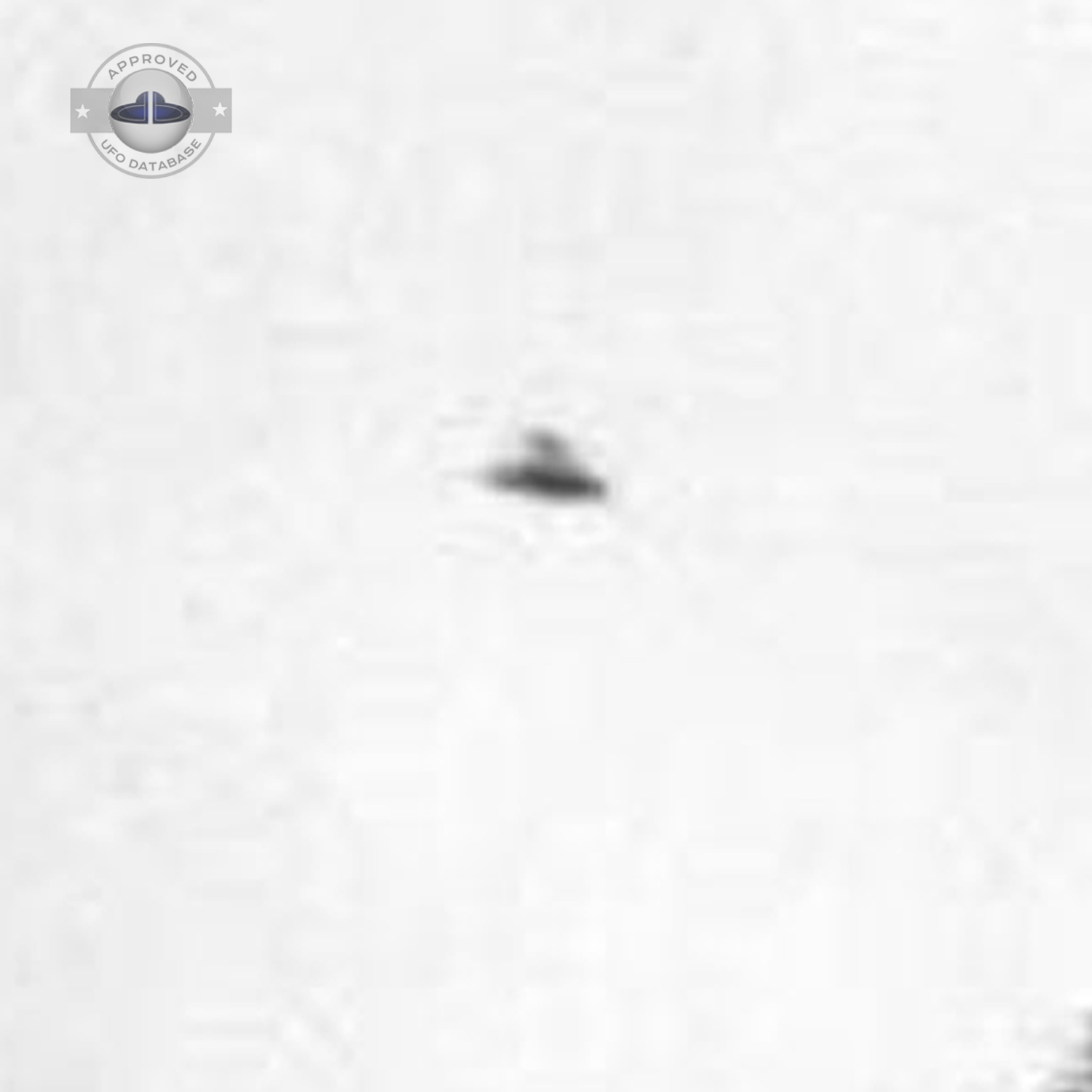 Black and white UFO picture showing UFO flying over busy street UFO Picture #43-4
