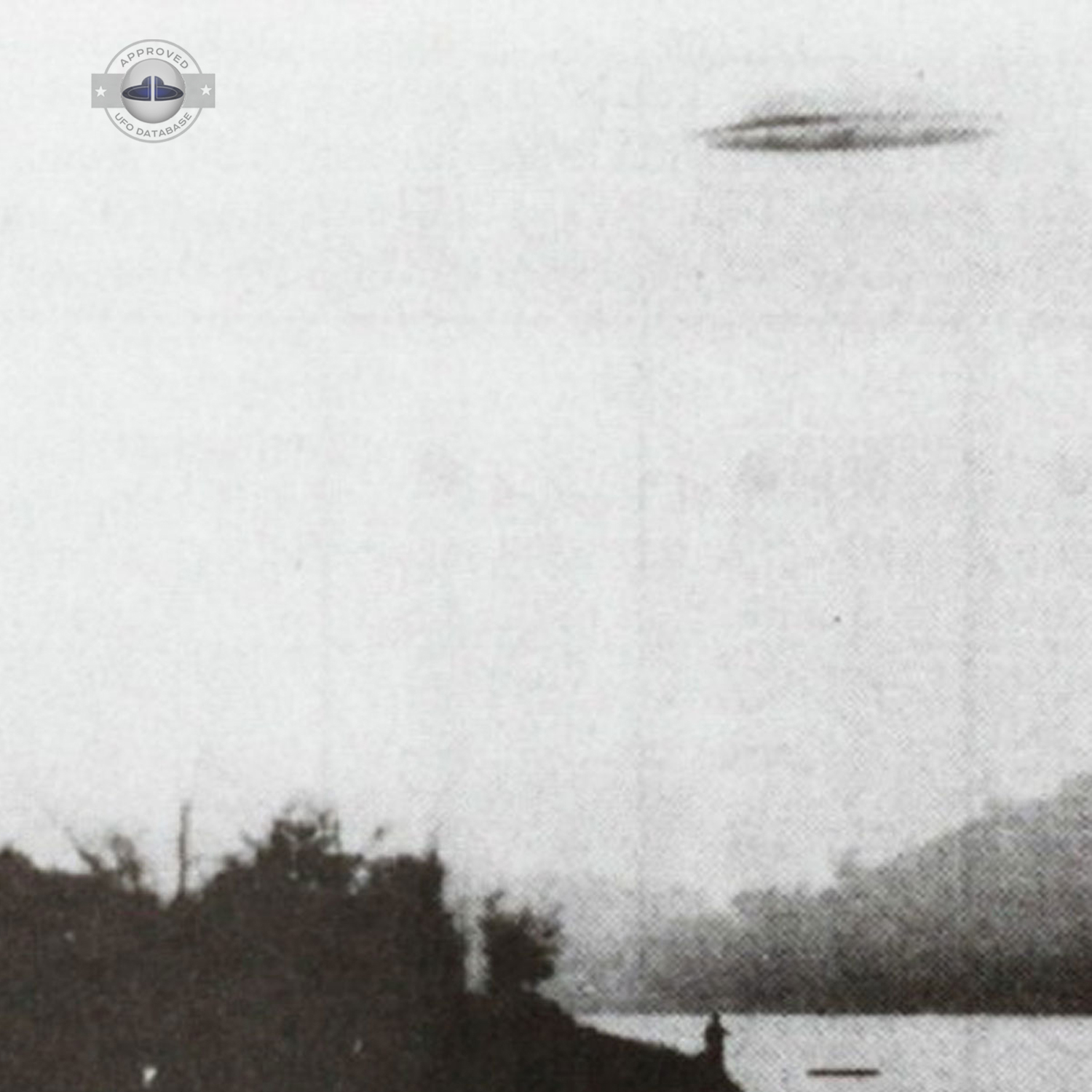 UFO over a fisherman and people in a canoe on a lake UFO Picture #45-2