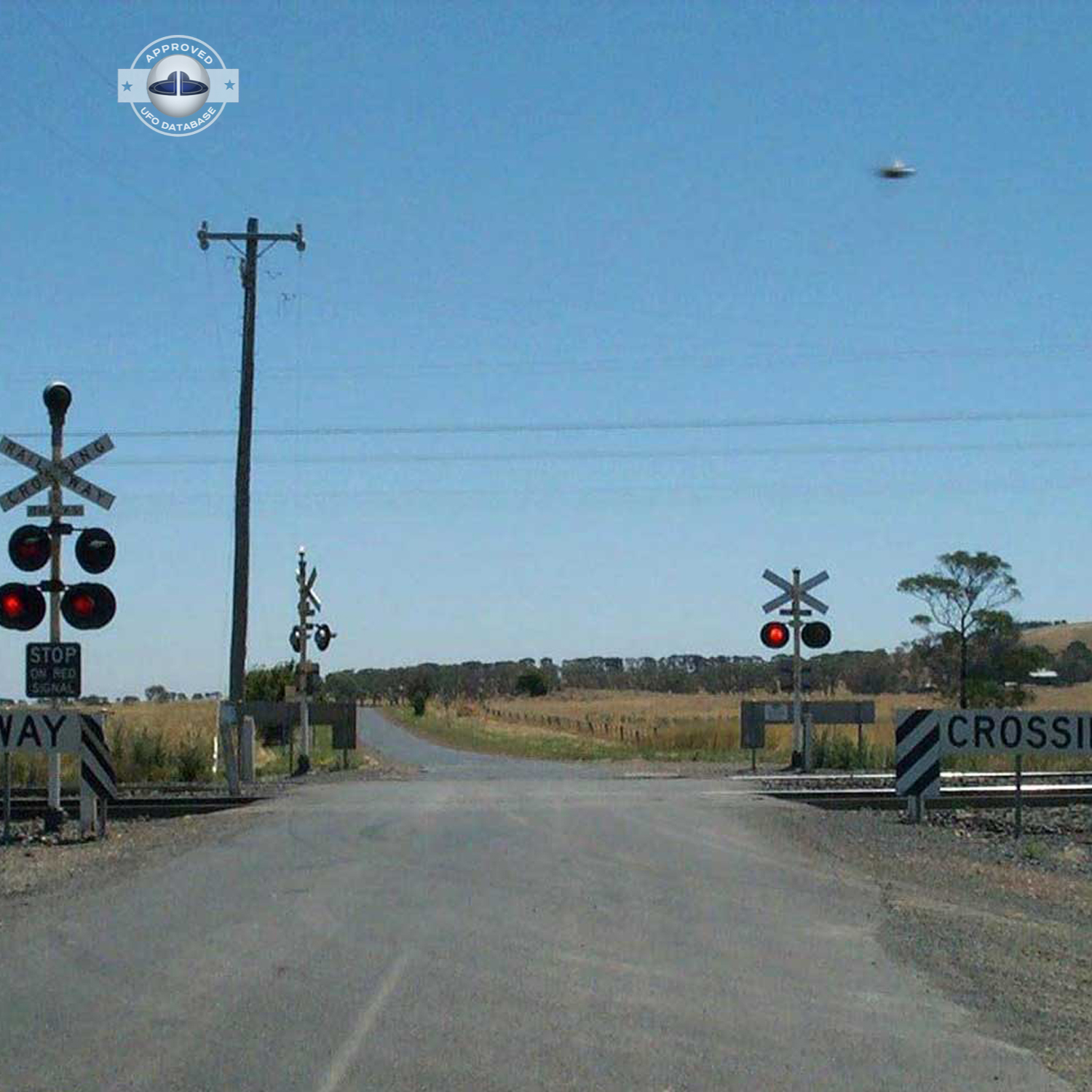 UFO picture showing UFO flying near railroad crossing UFO Picture #47-2