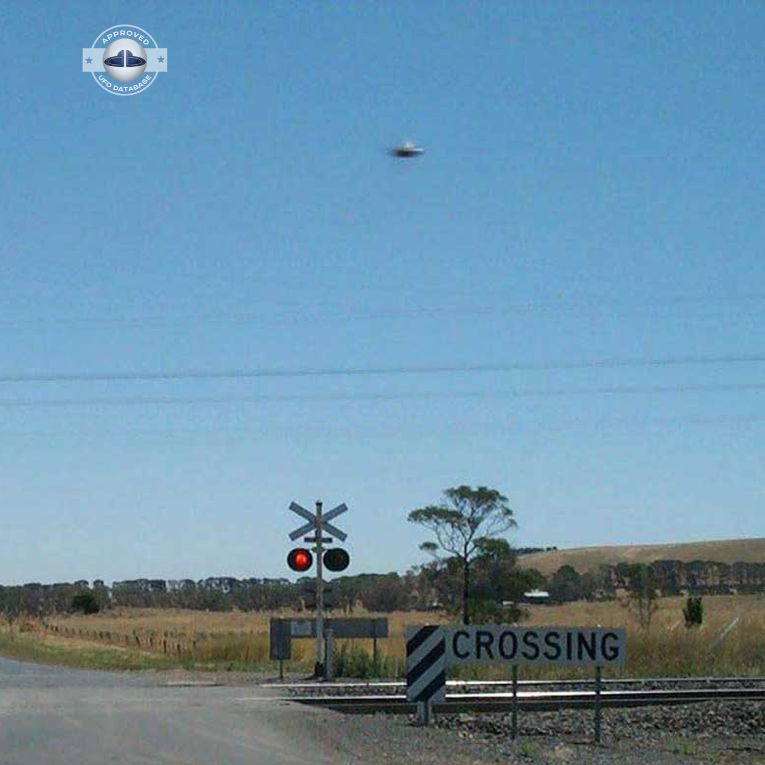 UFO picture showing UFO flying near railroad crossing UFO Picture #47-3