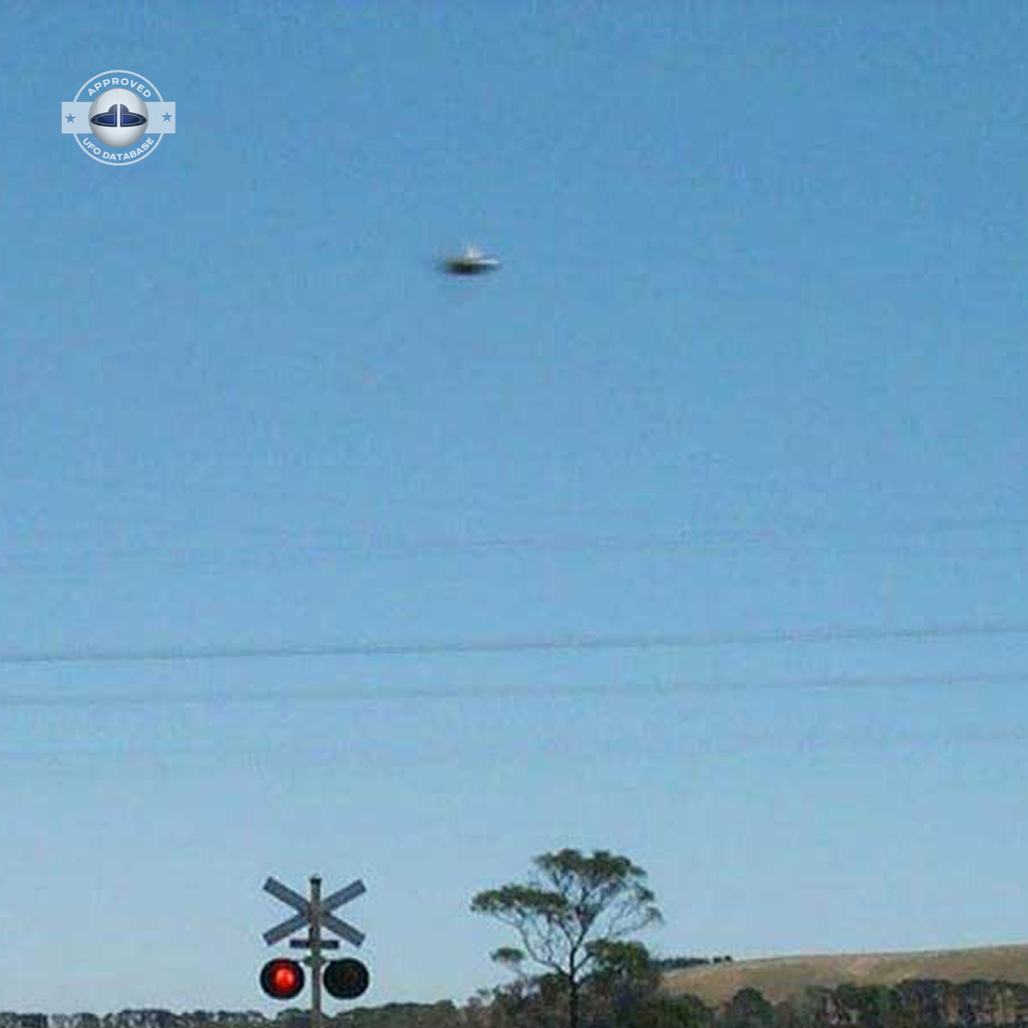 UFO picture showing UFO flying near railroad crossing UFO Picture #47-4