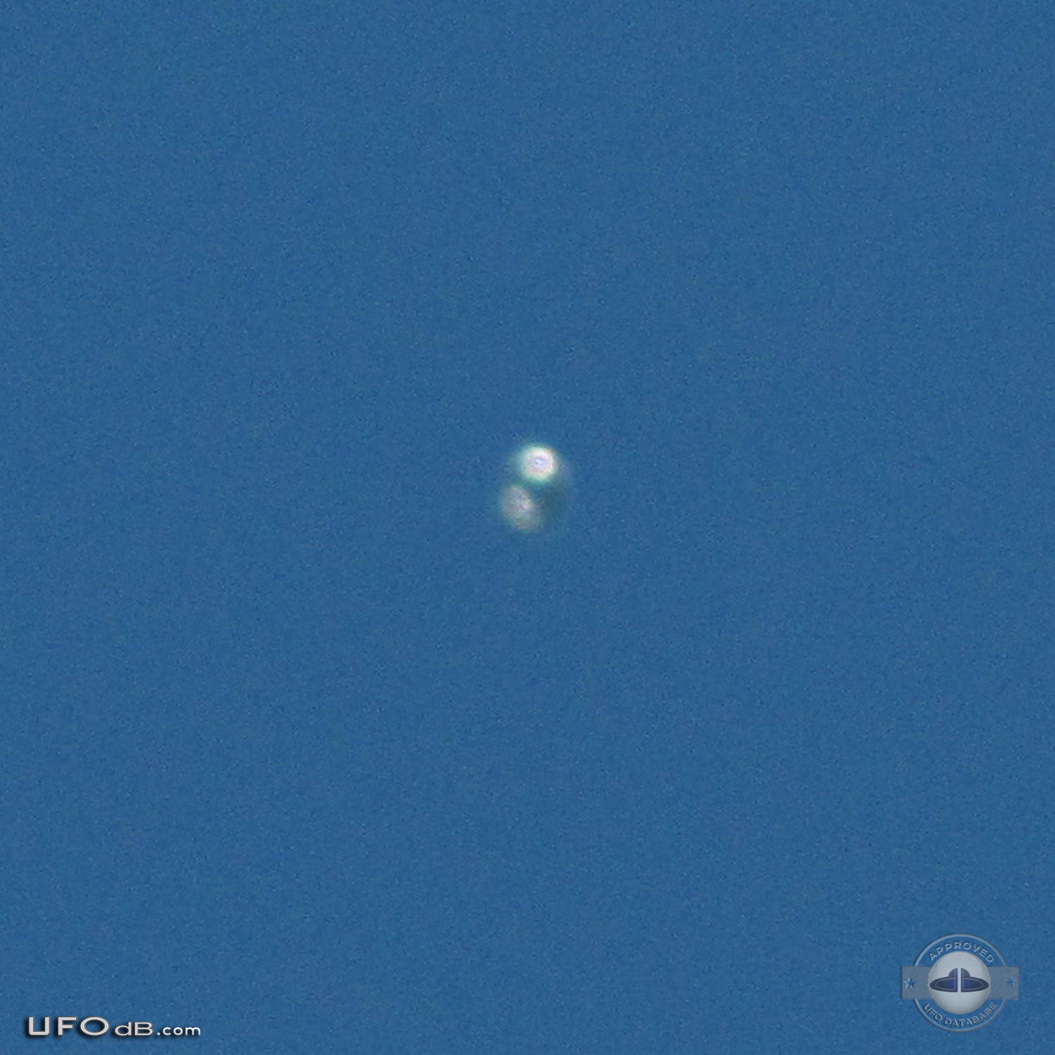 Donut shaped UFO with glowing silver material over Scituate Ma US 2012 UFO Picture #481-4