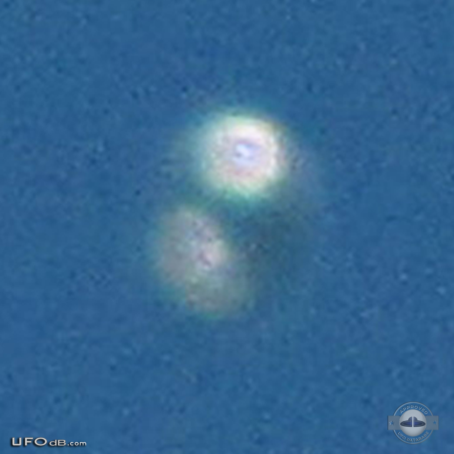 Donut shaped UFO with glowing silver material over Scituate Ma US 2012 UFO Picture #481-6