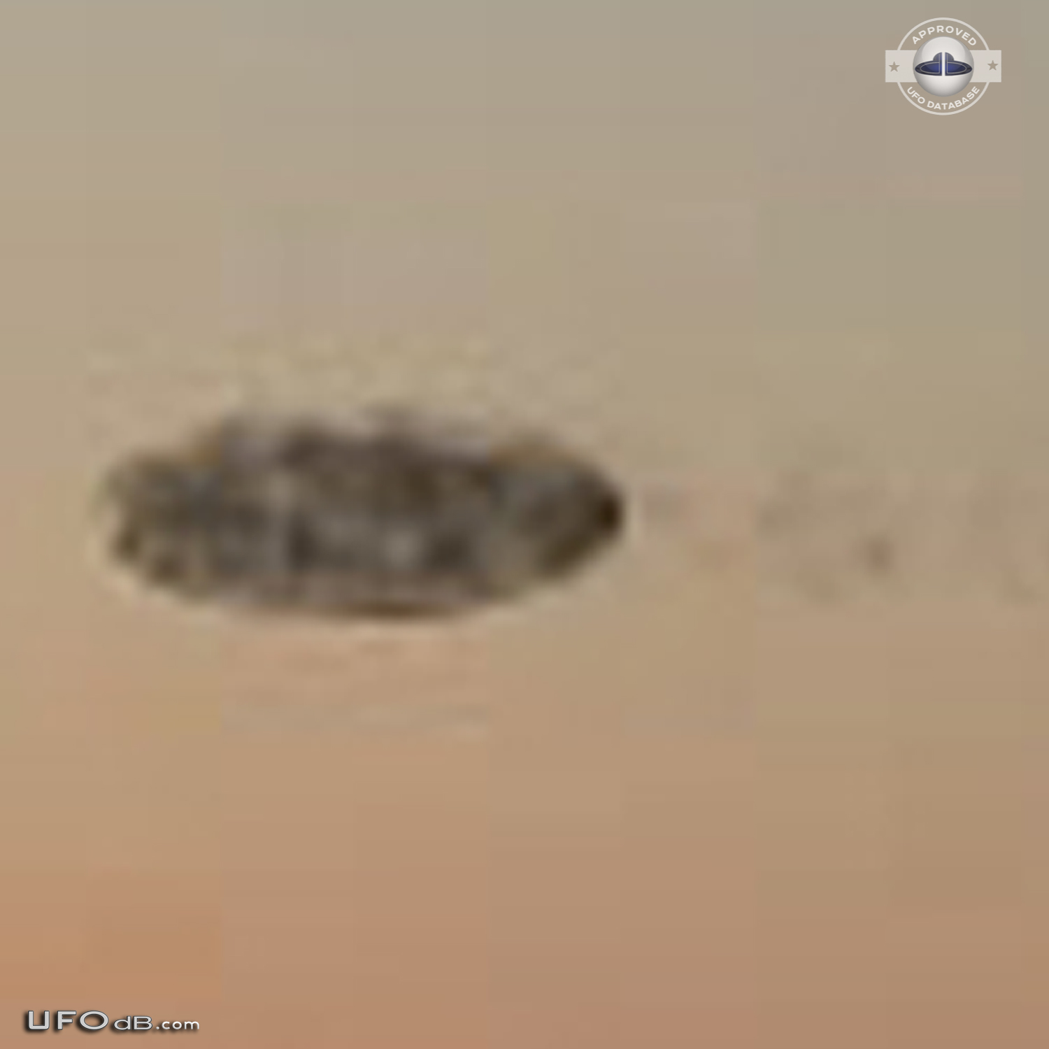 Dark shadowy disc UFO over the Mississippi New Orleans Louisiana 2012 UFO Picture #513-4