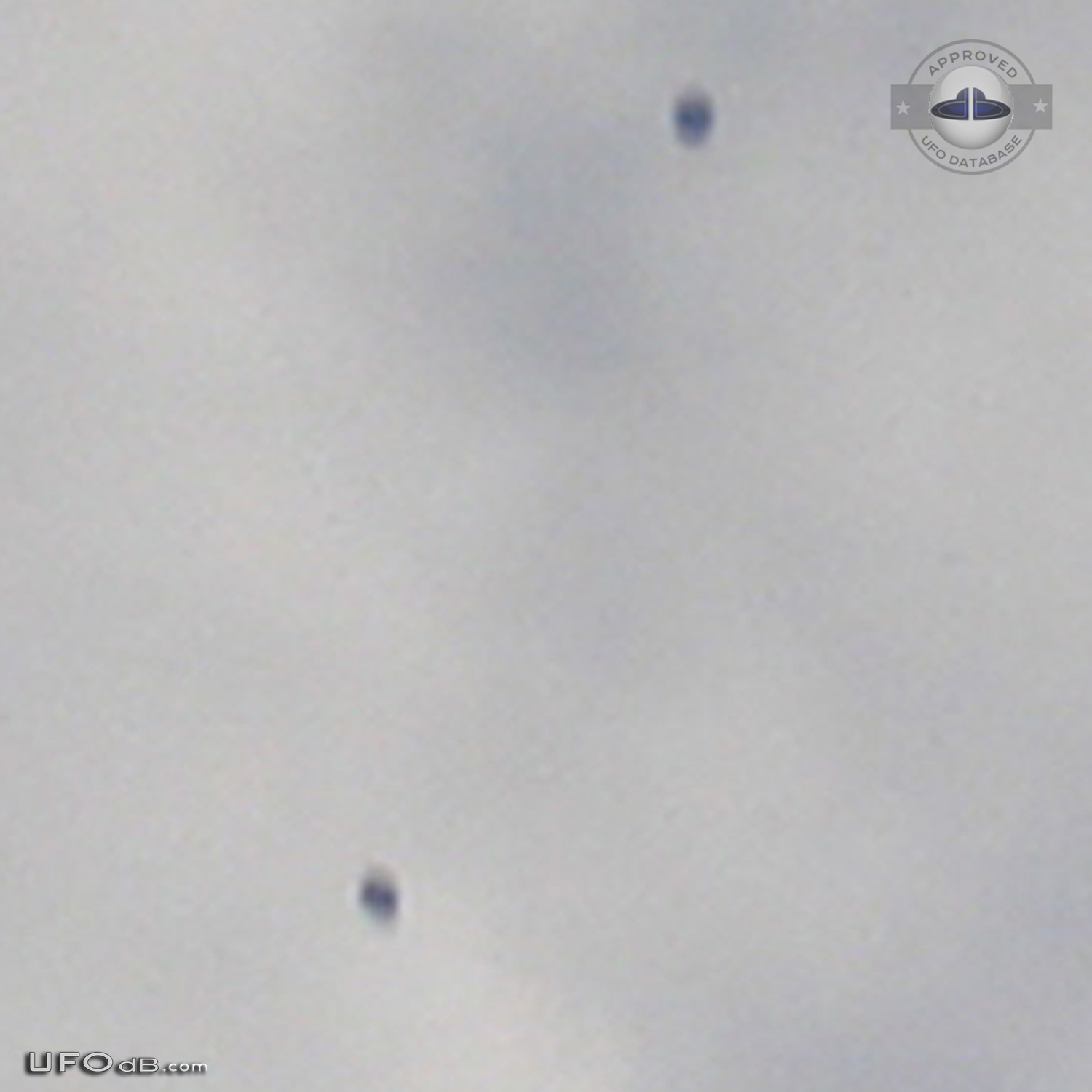 Four grey black disc UFOs near the airplane Mississauga, Ontario 2010 UFO Picture #531-3
