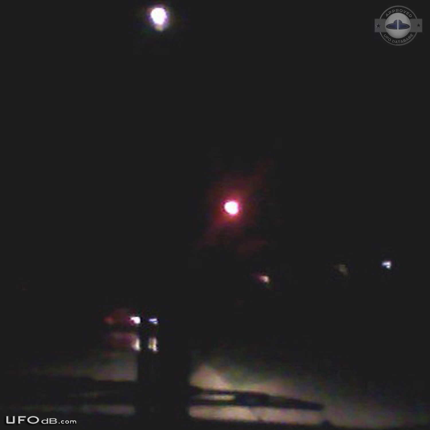 Bright glowing hovering sphere UFO over St Louis Missouri - 2014 UFO Picture #560-2