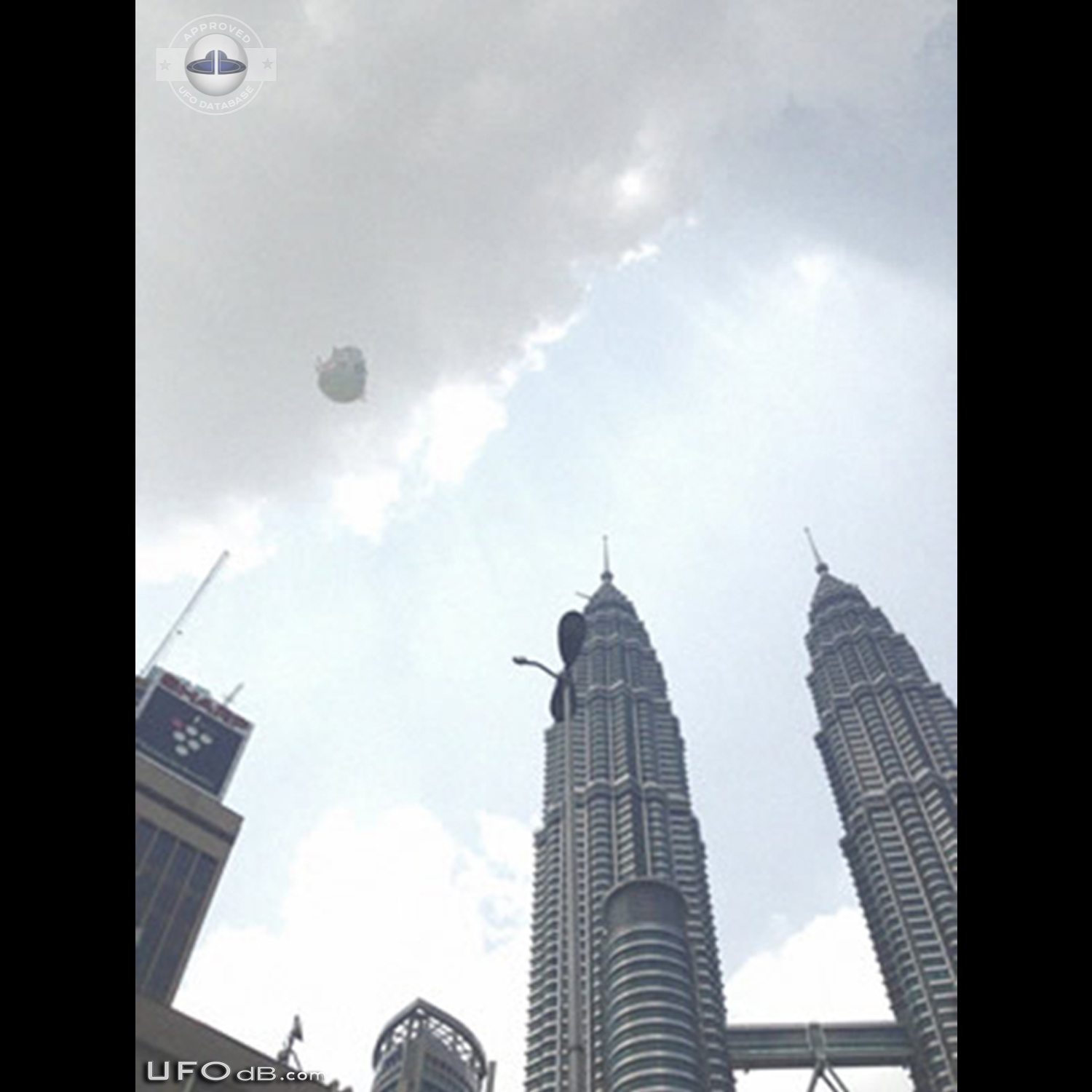 UFO near the Petronas Twin Towers in Kuala Lumpur, Malaysia - May 2014 UFO Picture #565-1