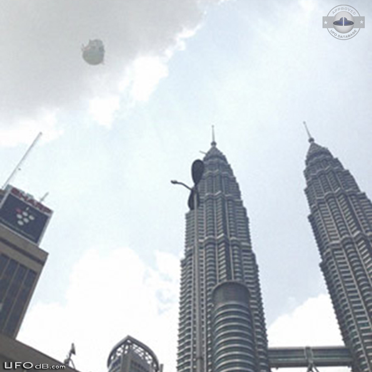 UFO near the Petronas Twin Towers in Kuala Lumpur, Malaysia - May 2014 UFO Picture #565-2