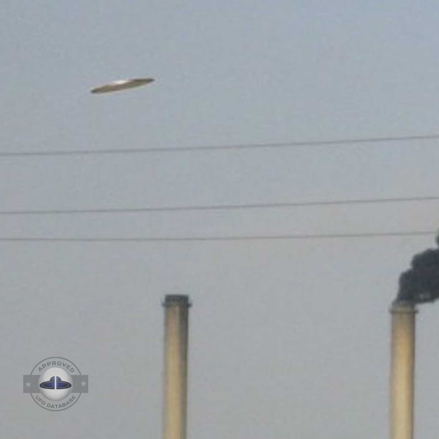 The flying saucer is flying over an industrial factory in Baghdad UFO Picture #58-3