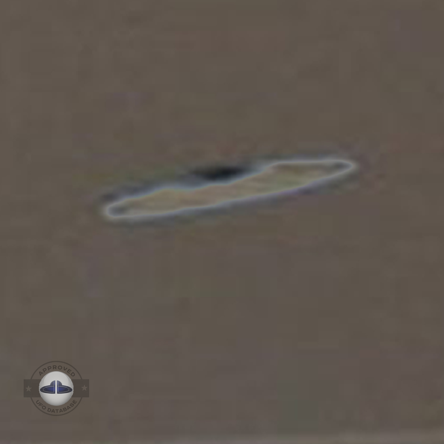 The flying saucer is flying over an industrial factory in Baghdad UFO Picture #58-6