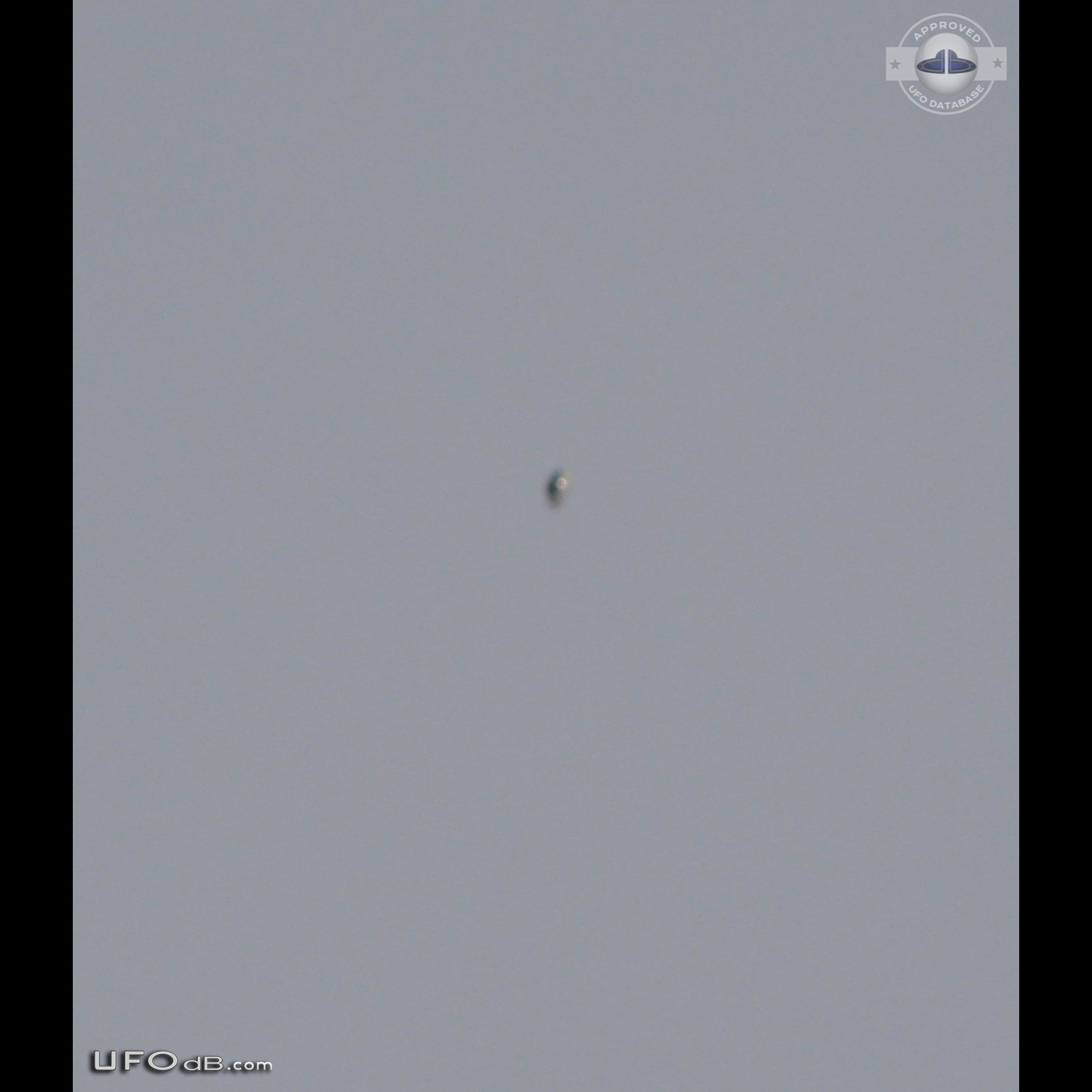 Shiny Upside-down Teardrop UFO rotating in the sky San Marcos CA USA UFO Picture #623-1