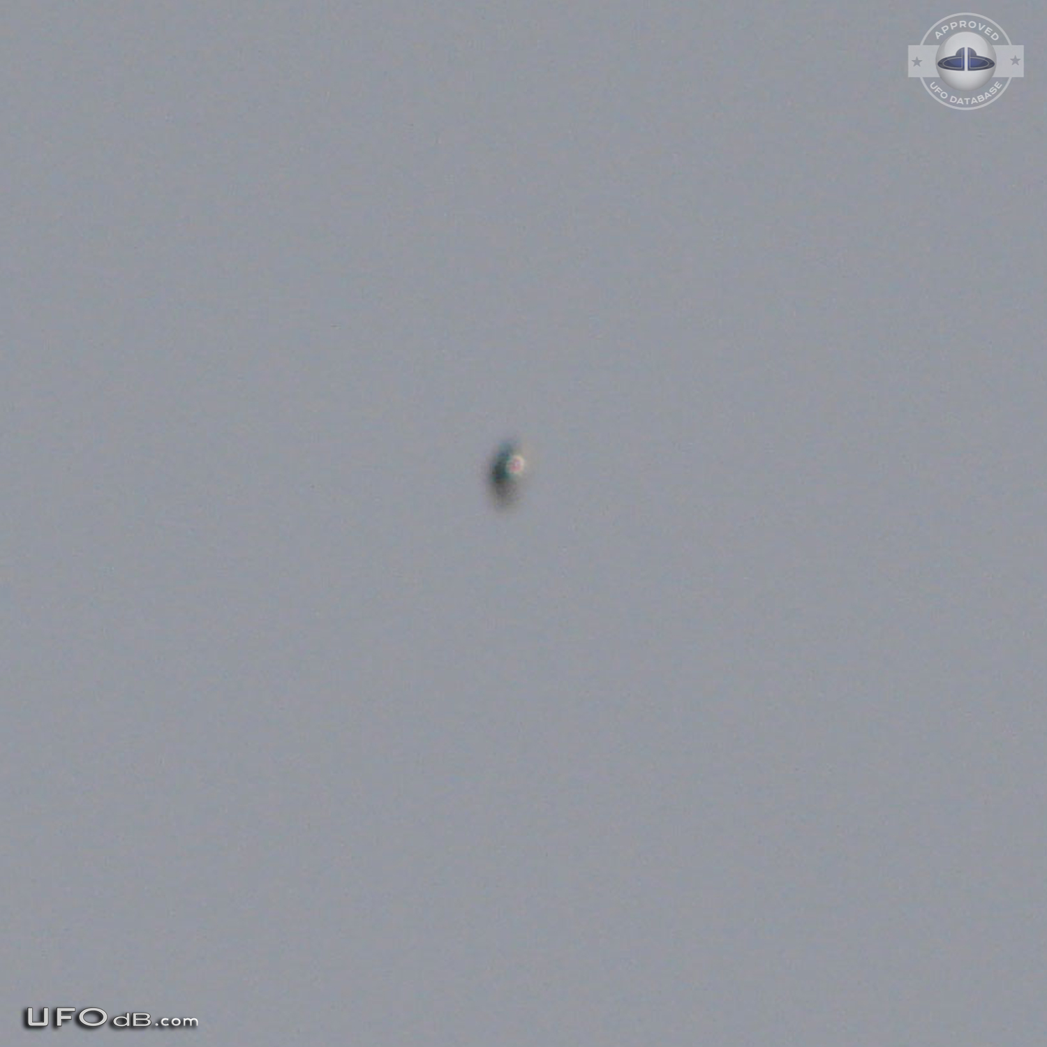 Shiny Upside-down Teardrop UFO rotating in the sky San Marcos CA USA UFO Picture #623-2