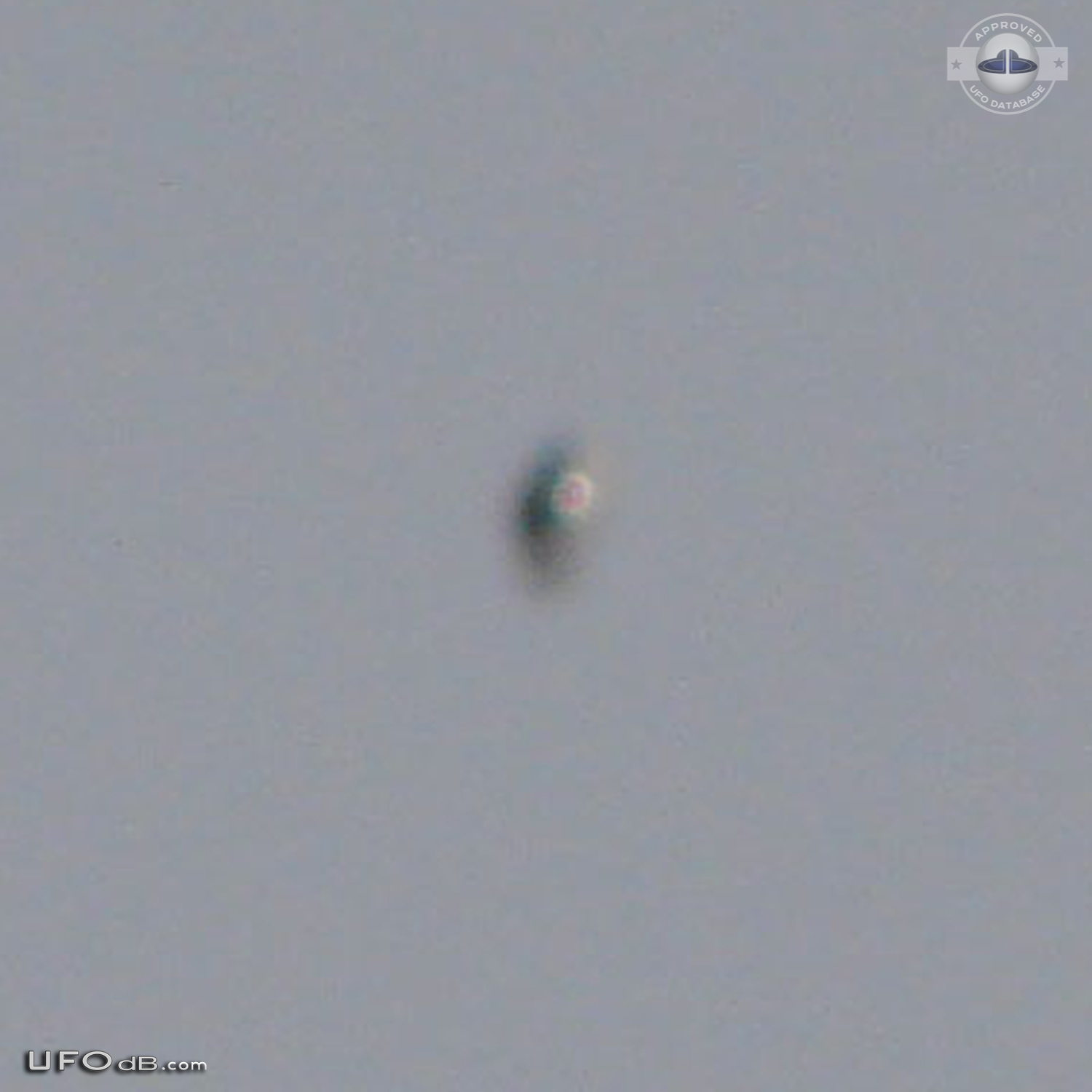 Shiny Upside-down Teardrop UFO rotating in the sky San Marcos CA USA UFO Picture #623-3